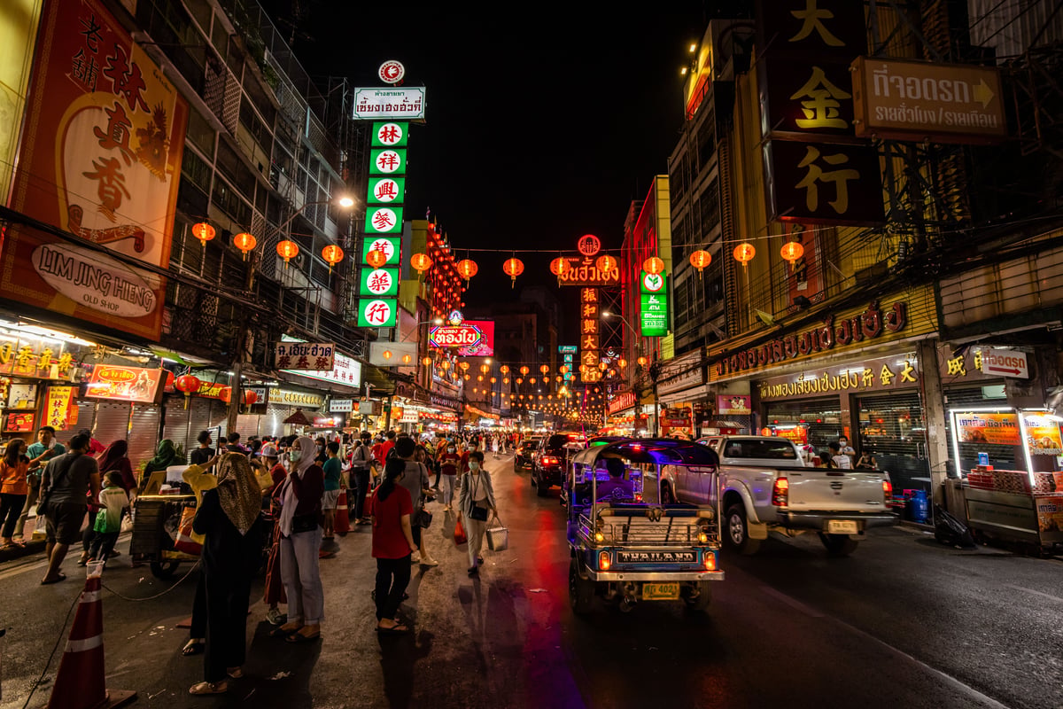Bangkok Chinatown street life at night, neon and food stalls