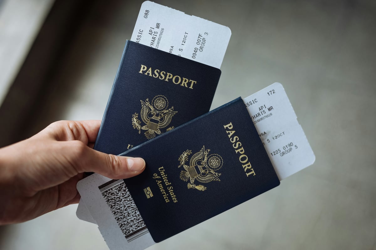 A passport and boarding pass, travel-document flat lay