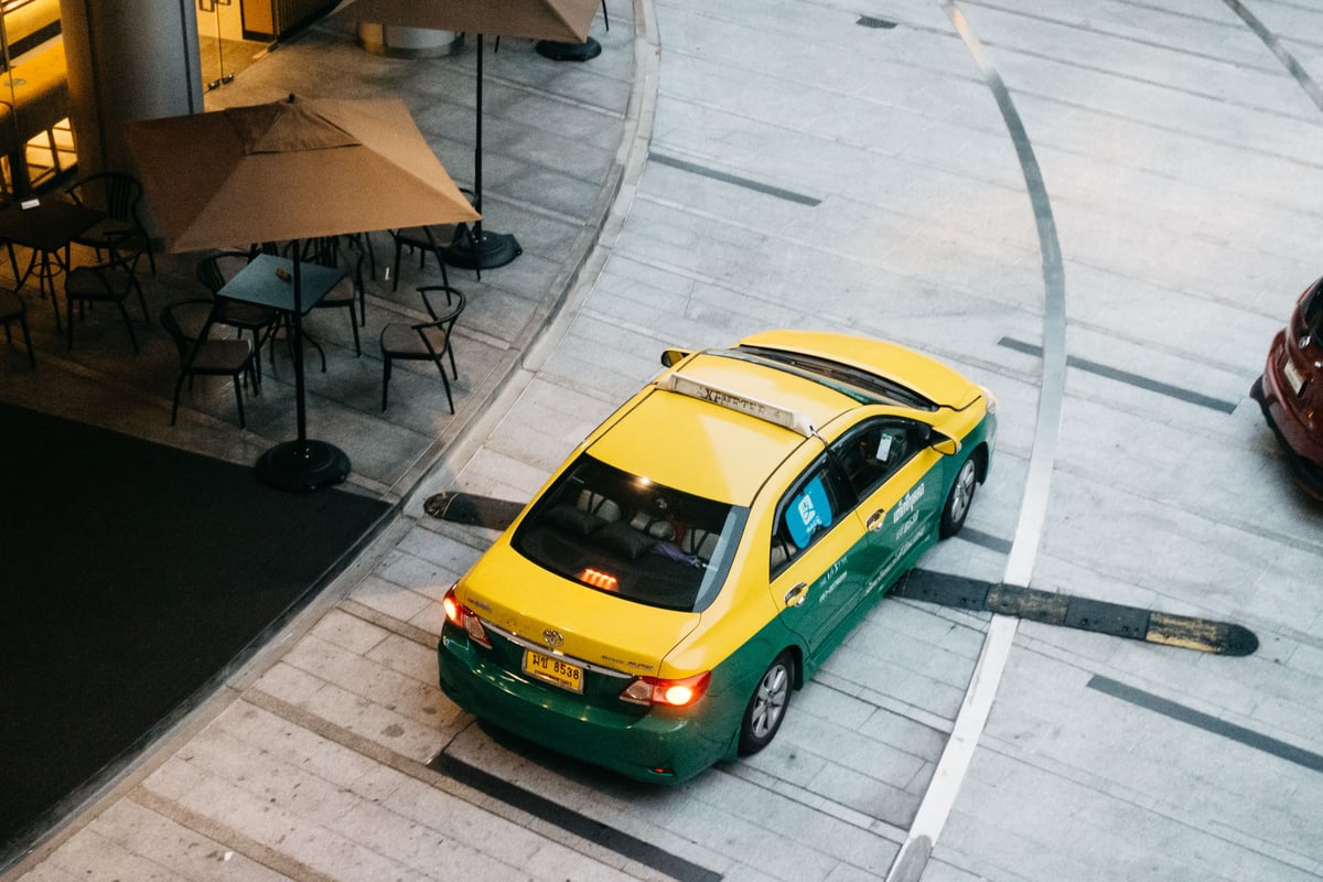A Grab car or driver in a Thai street setting