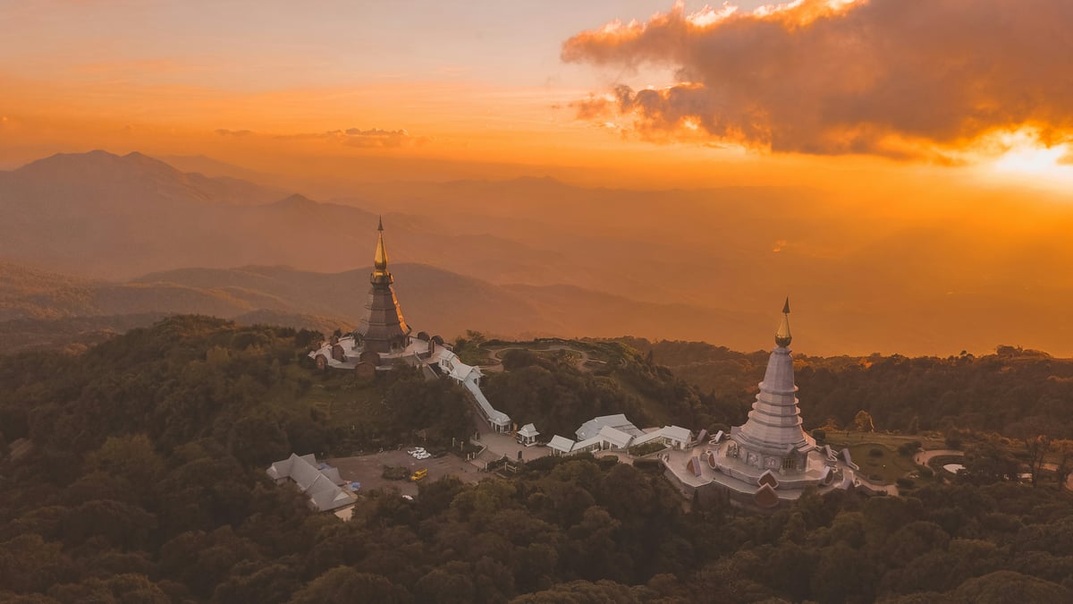 A montage feel of Thailand — temple, mountains, and island