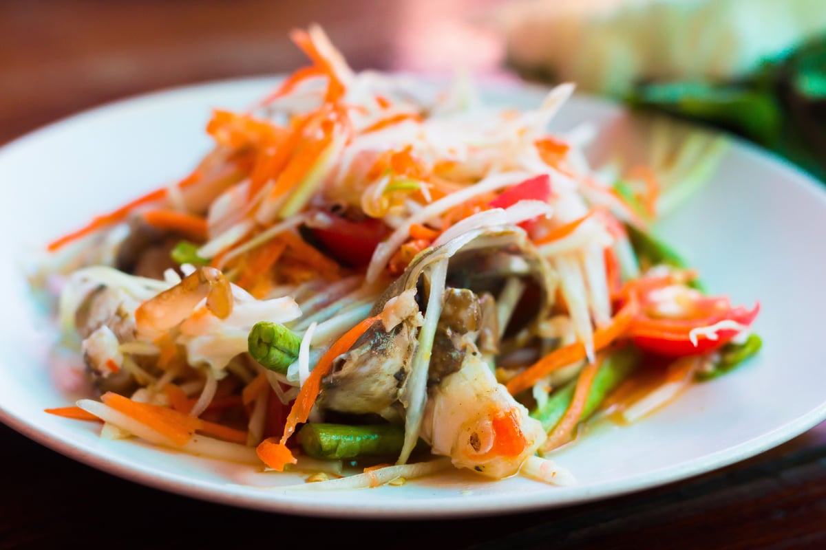 Isan food — som tum, grilled chicken, and sticky rice