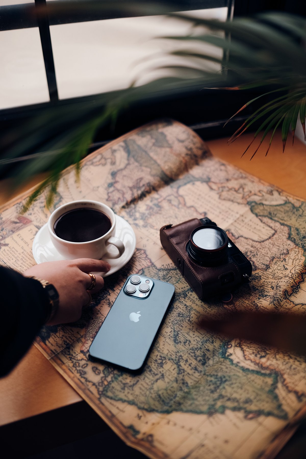 A traveler using a phone in a Thai café or street setting