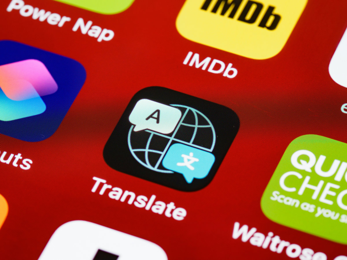 A phone showing a maps or translation app with Thai text