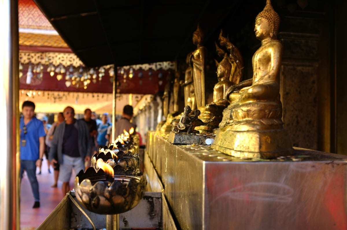 A respectful cultural scene — a wai greeting or a serene temple