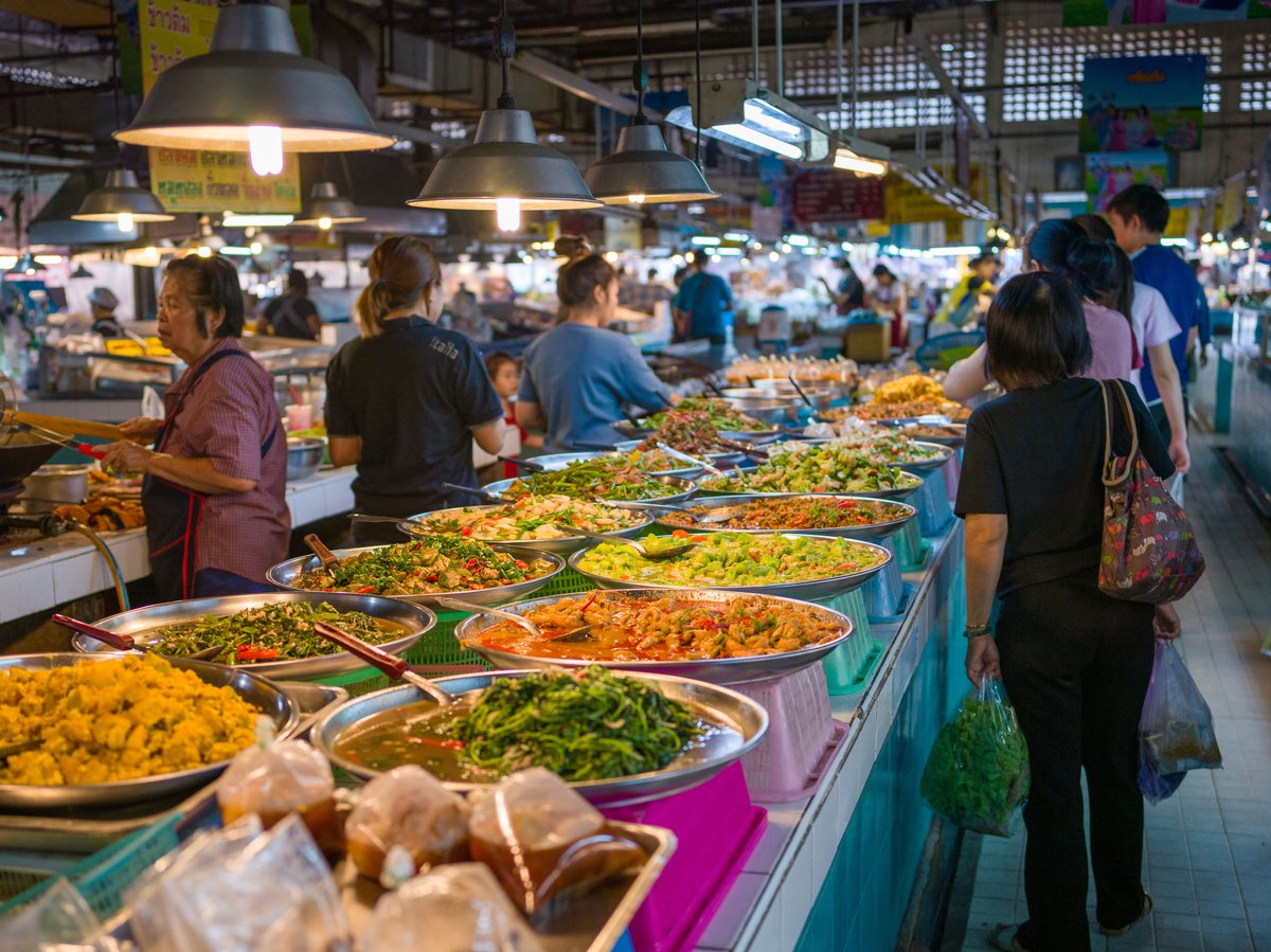 A colorful spread of Thai dishes on a table