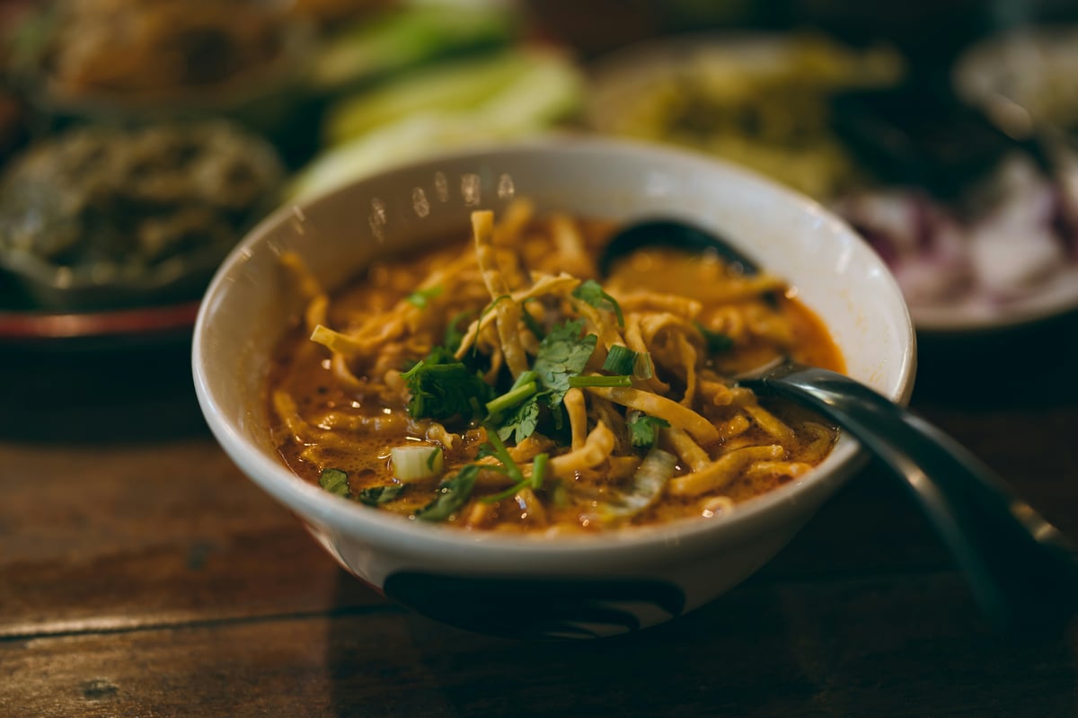A steaming bowl of khao soi or a plate of pad krapow