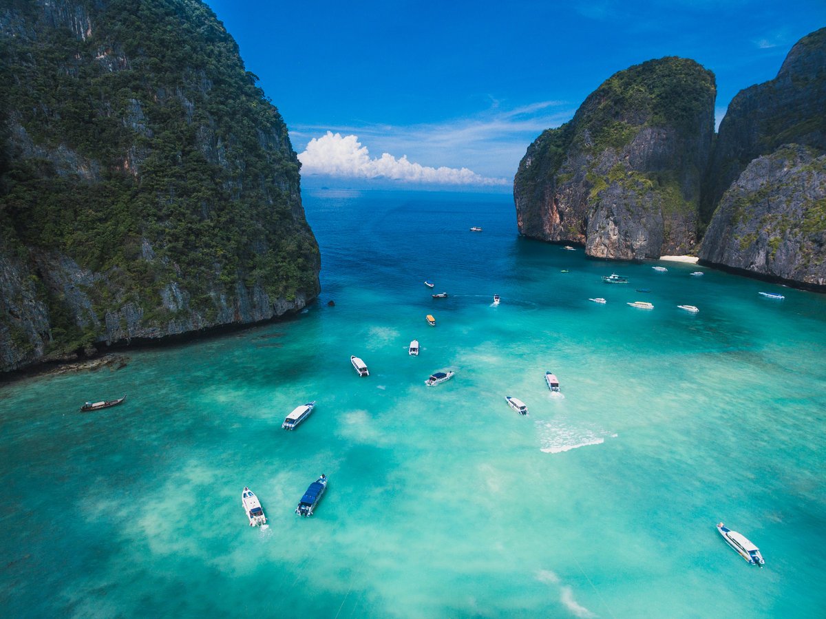 Split-feel image of a turquoise Andaman bay with limestone karsts