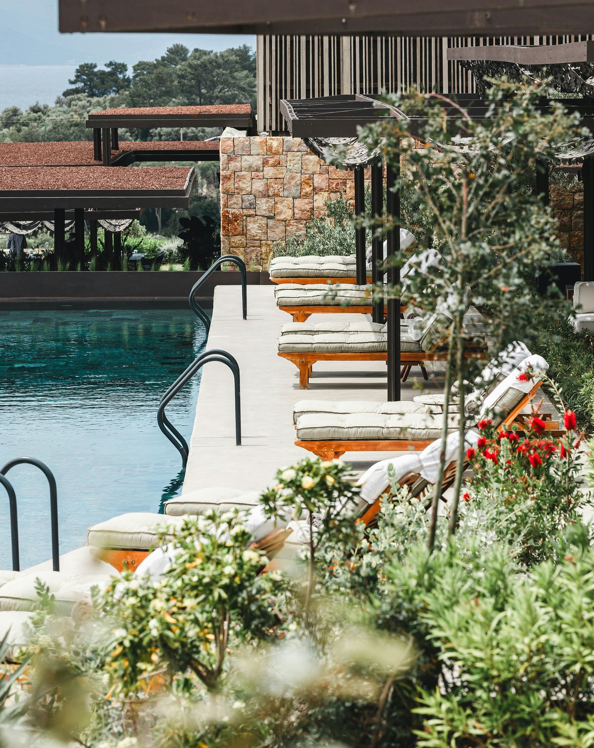 A large beachfront all-inclusive resort pool overlooking the Mediterranean on the Turkish Riviera, no recognizable faces