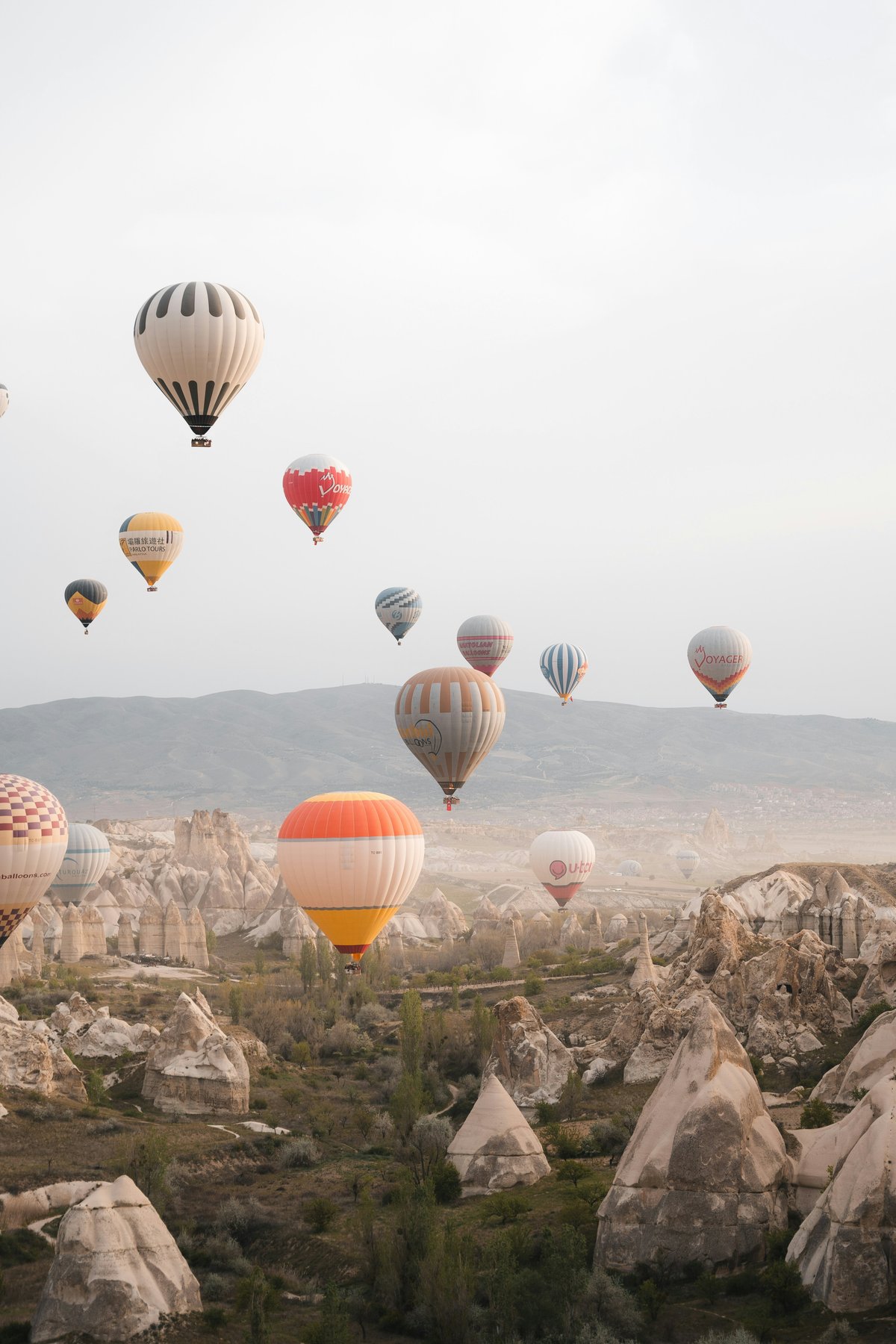 Hot air balloons over Cappadocia on a clear shoulder-season morning
