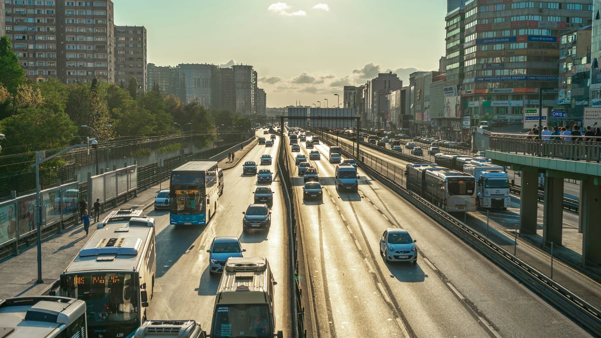 a highway crossing a Bosphorus bridge or a wide Istanbul motorway, traffic at distance, no readable plates