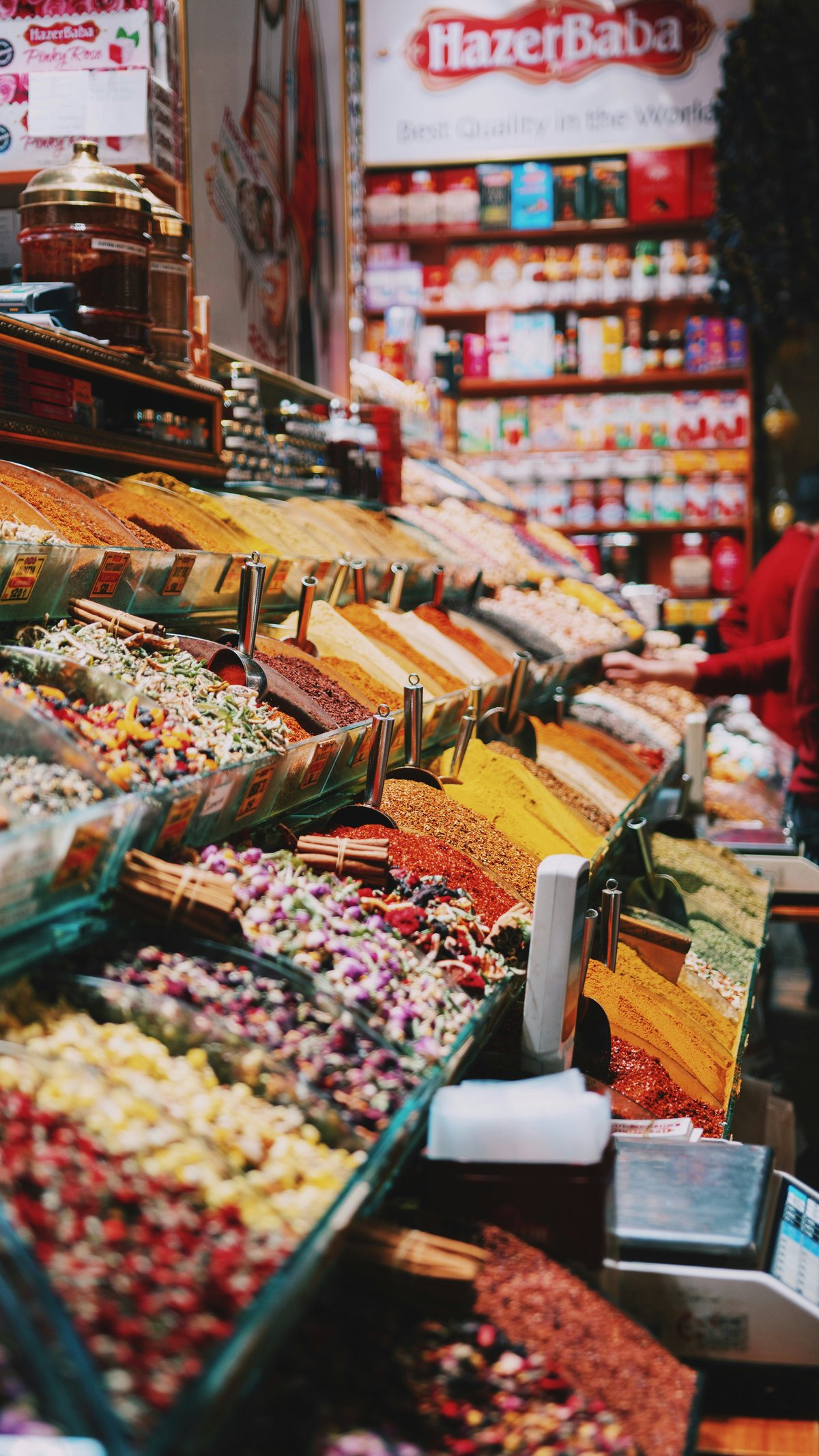 a Turkish bazaar stall with goods and a small cash box, objects only, no people, no readable prices