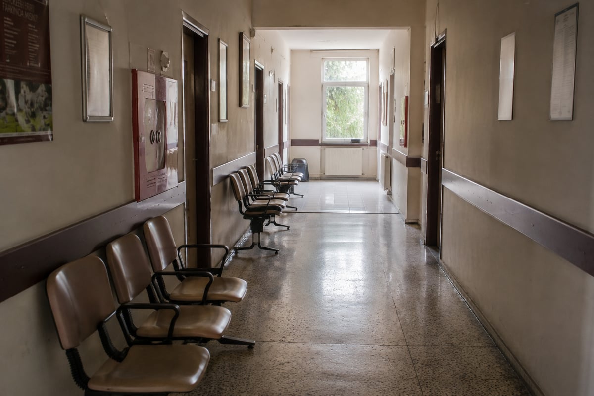 a quiet Turkish clinic corridor or waiting area, empty, daylight, no patients, no medical equipment in use, no distress