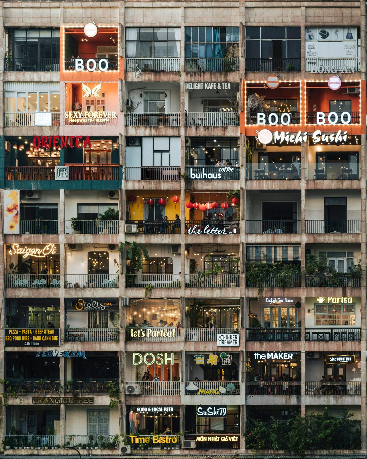 The converted apartment block on Nguyen Hue, its balconies filled with small cafes