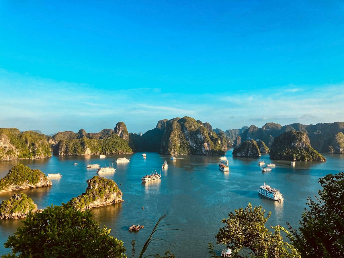 Turquoise water and karst islands on the Vietnamese coast seen from above