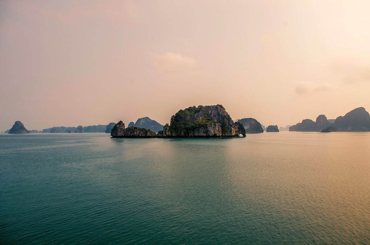 Limestone karst islands in Ha Long Bay seen from the air at sunset