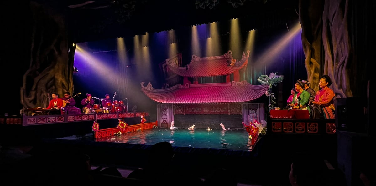 The pool and painted pavilion of a Vietnamese water puppet theatre stage