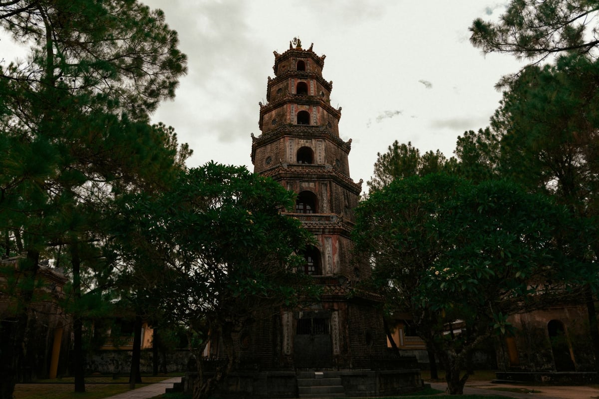 Thien Mu Pagoda, a seven-tiered brick tower among pines above the Perfume River