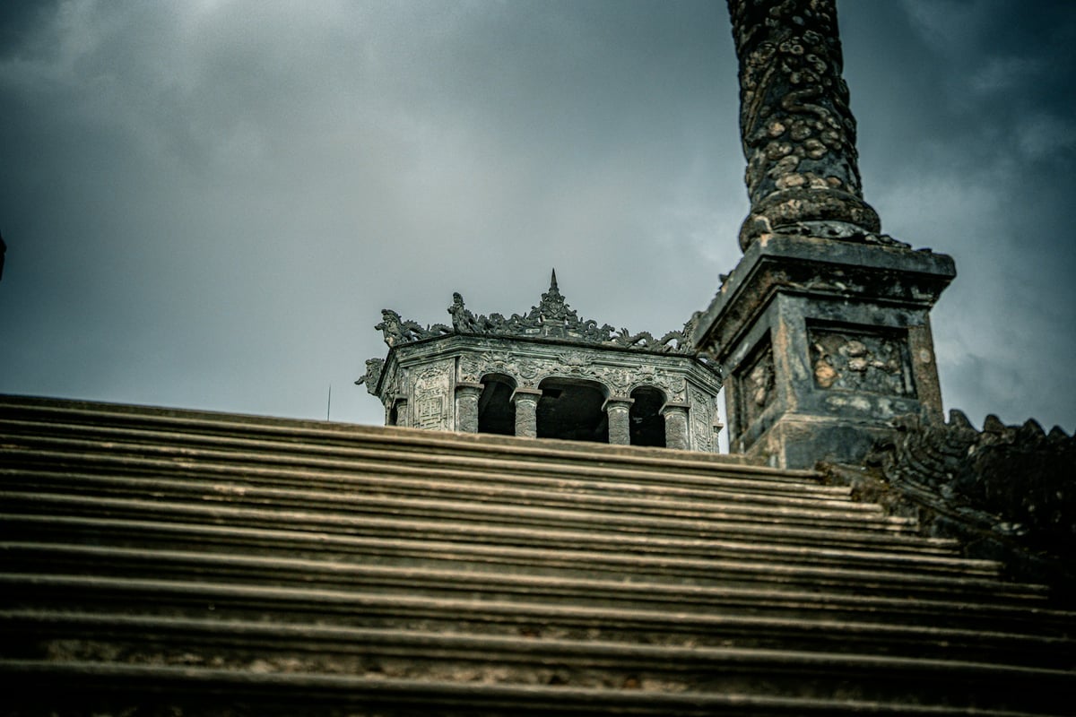 Stone steps climbing to a weathered shrine entrance