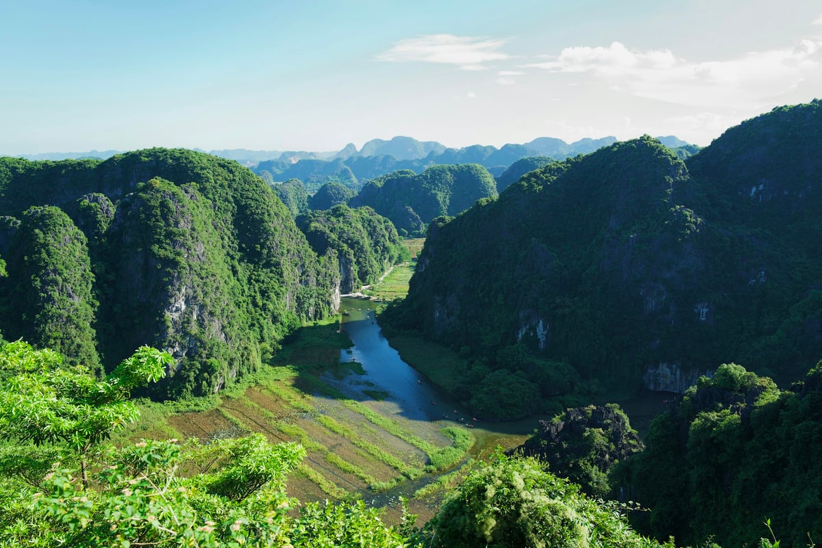 Karst hills reflected in a river in northern Vietnam