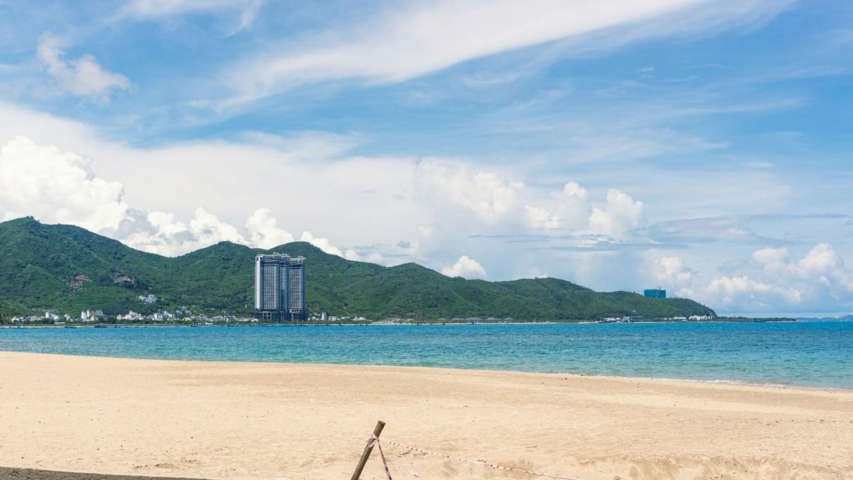 Nha Trang's municipal beach with the city's towers rising behind it