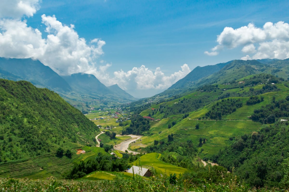 A green valley between steep mountains in northern Vietnam