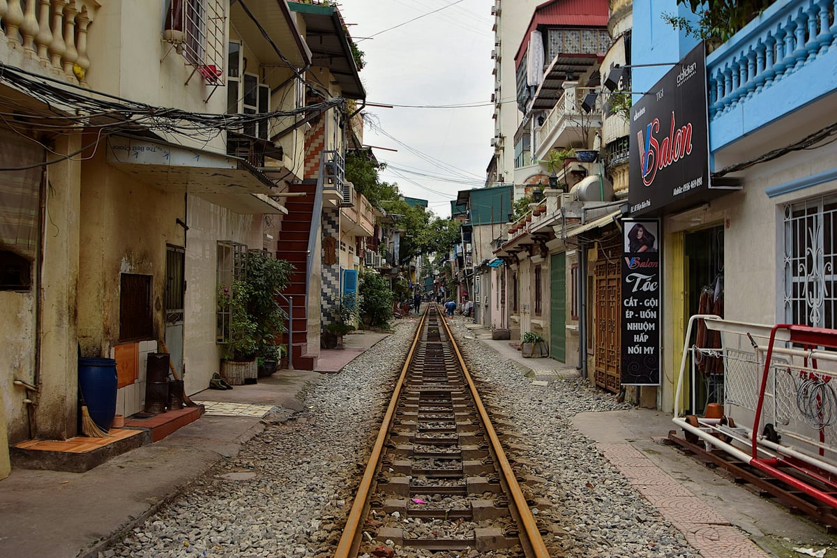 Empty railway tracks running between close-packed houses on Hanoi's Train Street