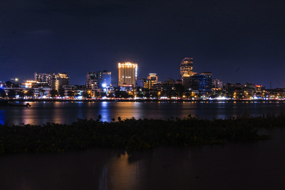 Phnom Penh lit at night seen across the river