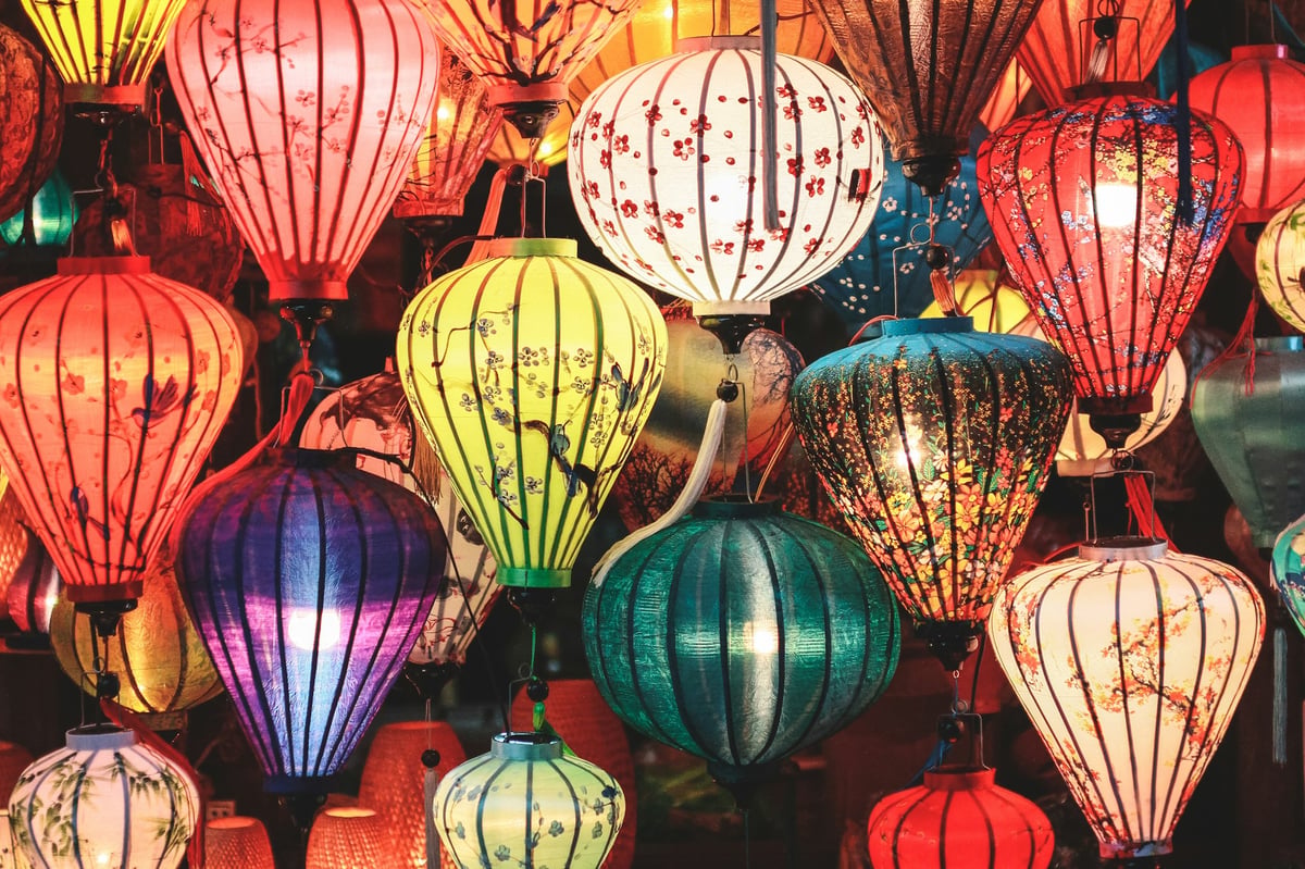 Rows of brightly coloured silk lanterns hanging in a Hoi An lantern shop