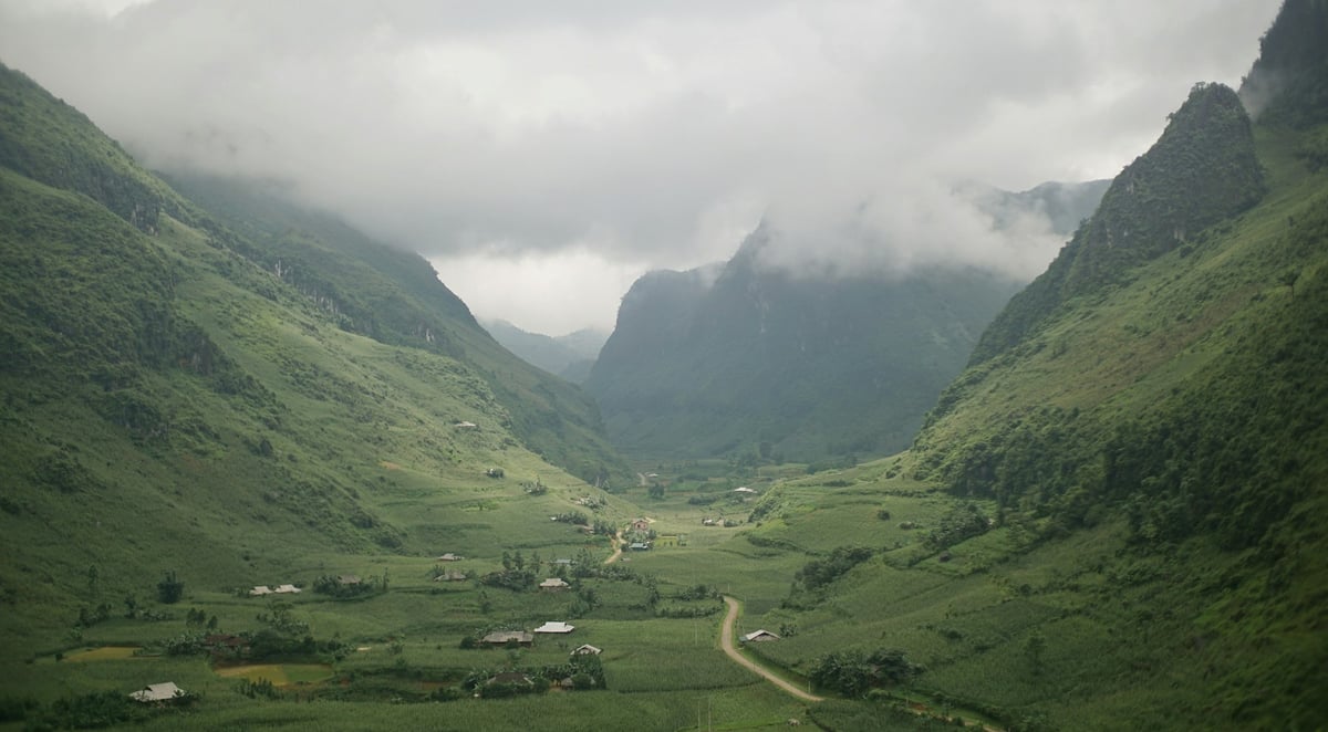 A misty valley of fields and scattered houses in the far north of Vietnam