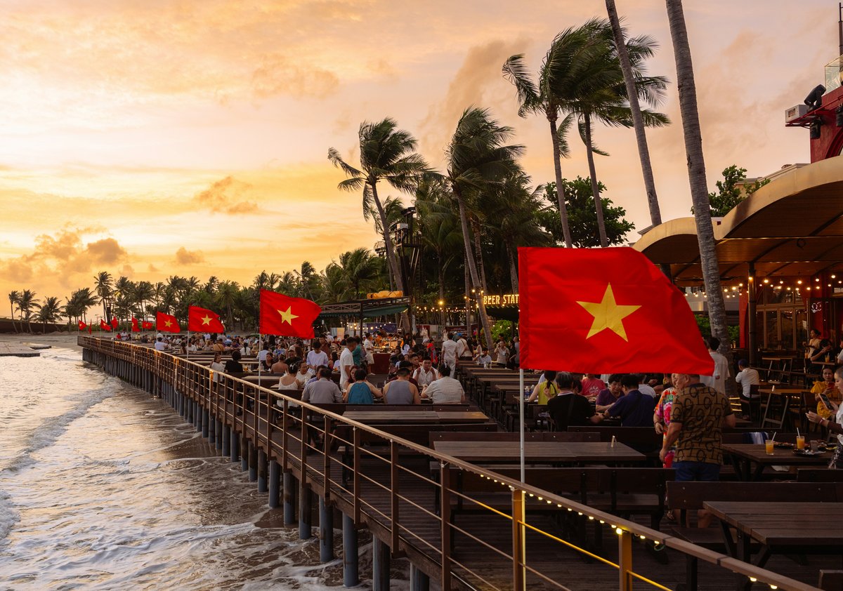 A seafront crowded with Vietnamese holidaymakers, the beach packed with swimmers and umbrellas