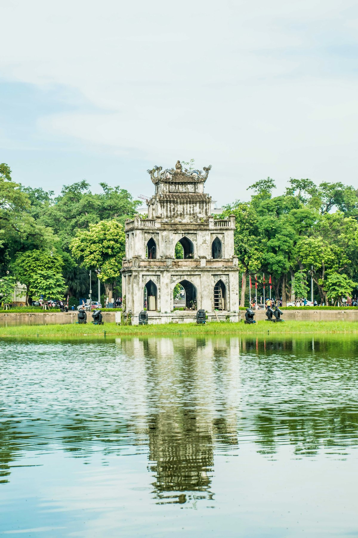 A quiet tree-lined temple gateway away from Hanoi's Old Quarter
