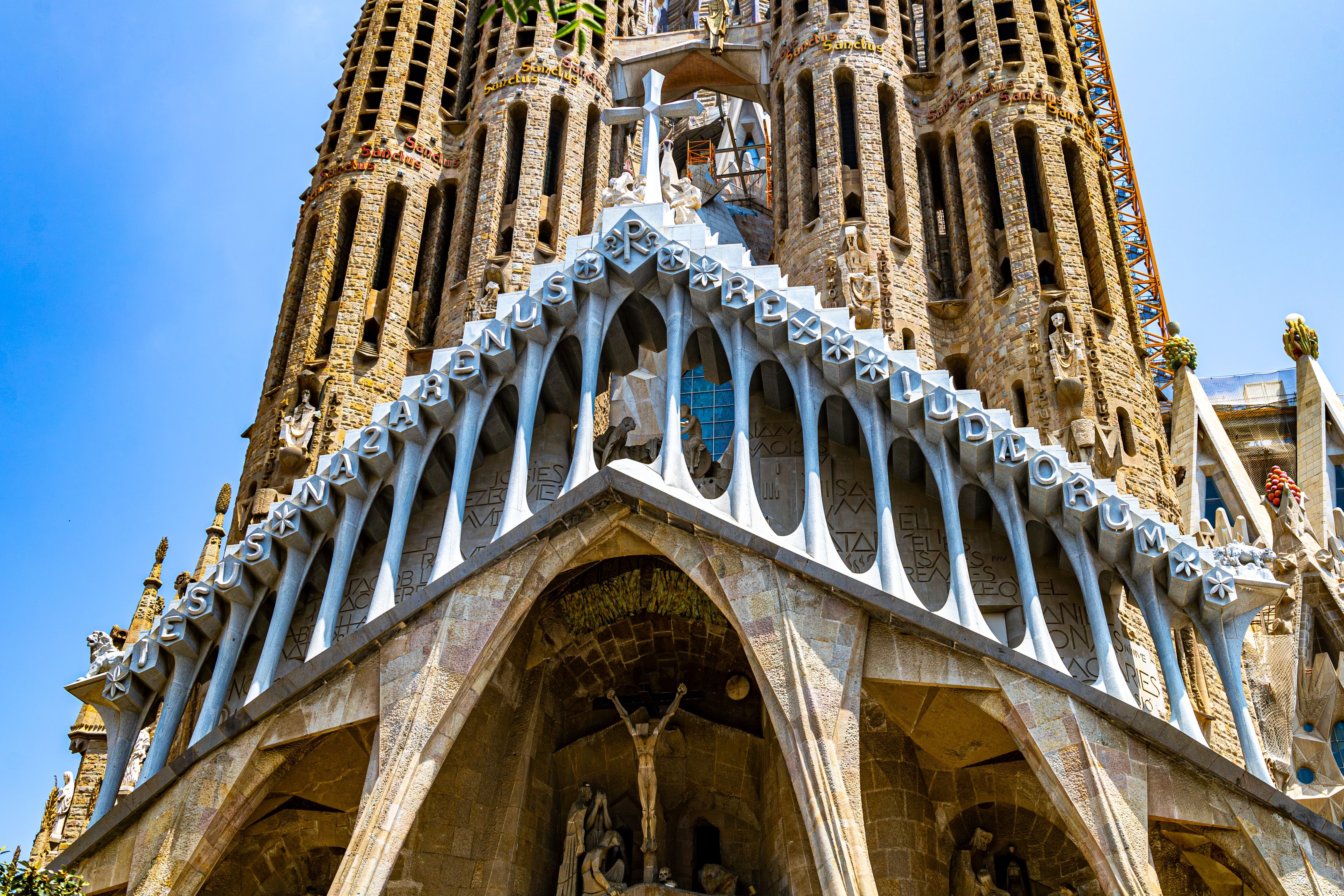 Morning light on the Sagrada Família Nativity facade, or the basilica seen from Plaça de Gaudí across the pond