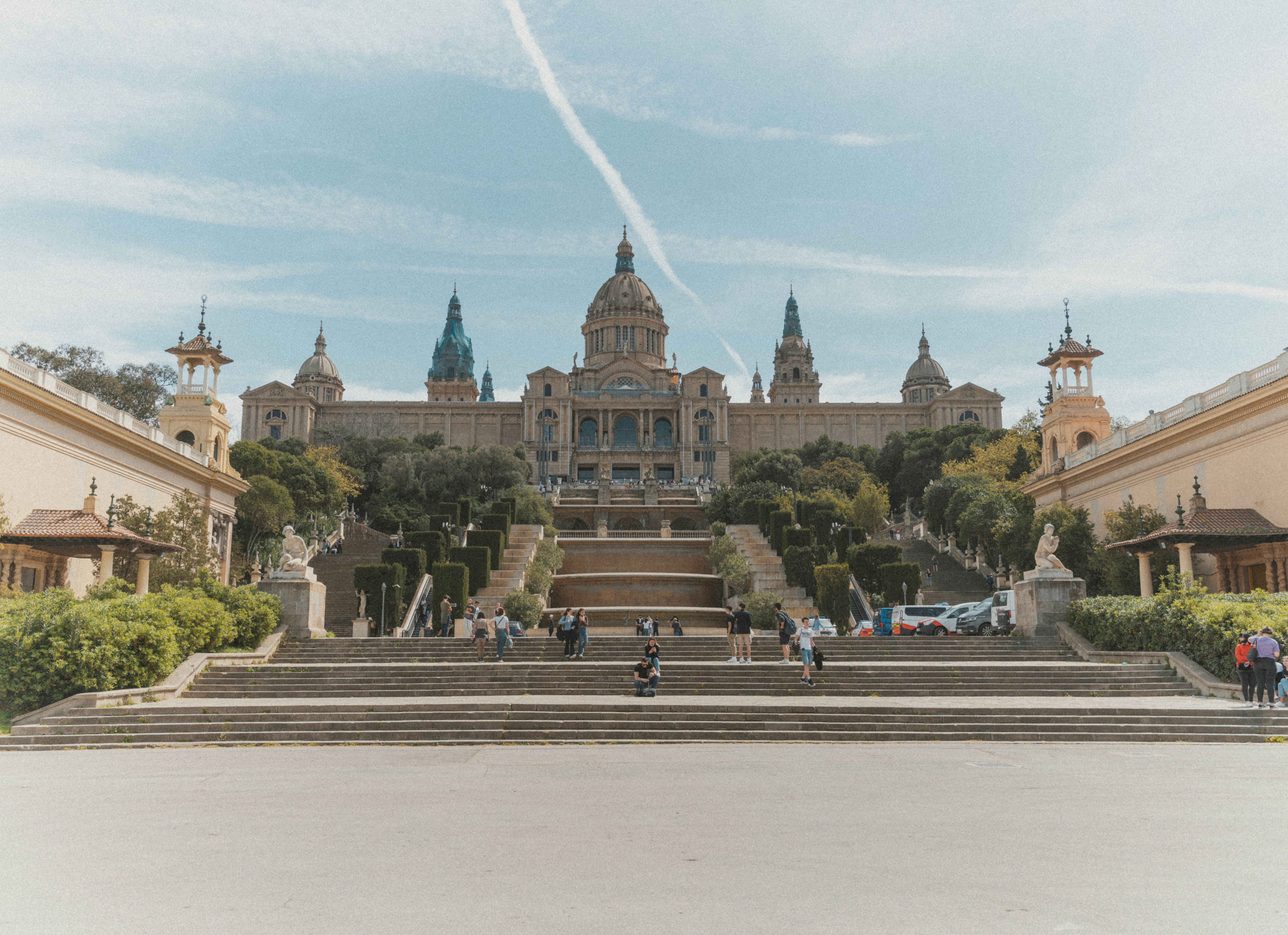 A relaxed Barcelona scene — a Gràcia plaça, café terrace, or the Eixample at golden hour