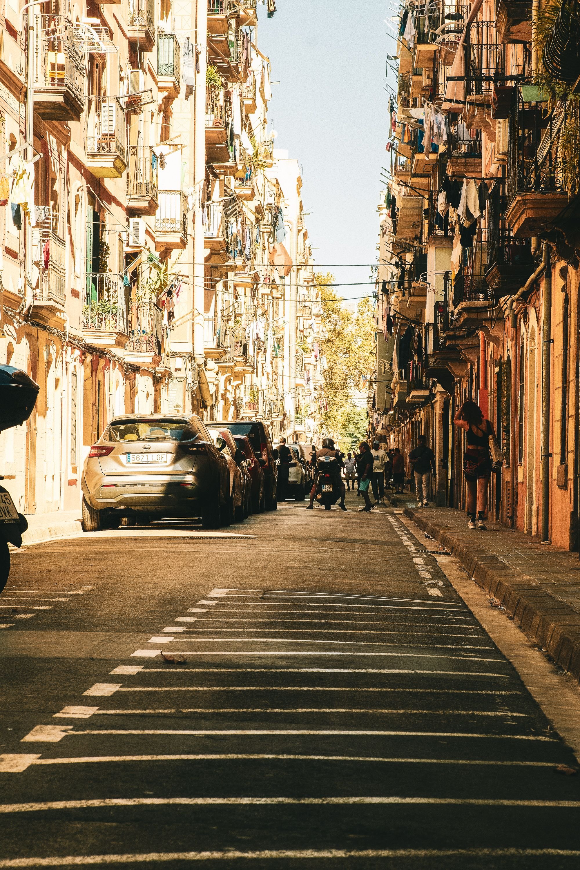A Barcelona residential balcony street scene in the Eixample or Gràcia