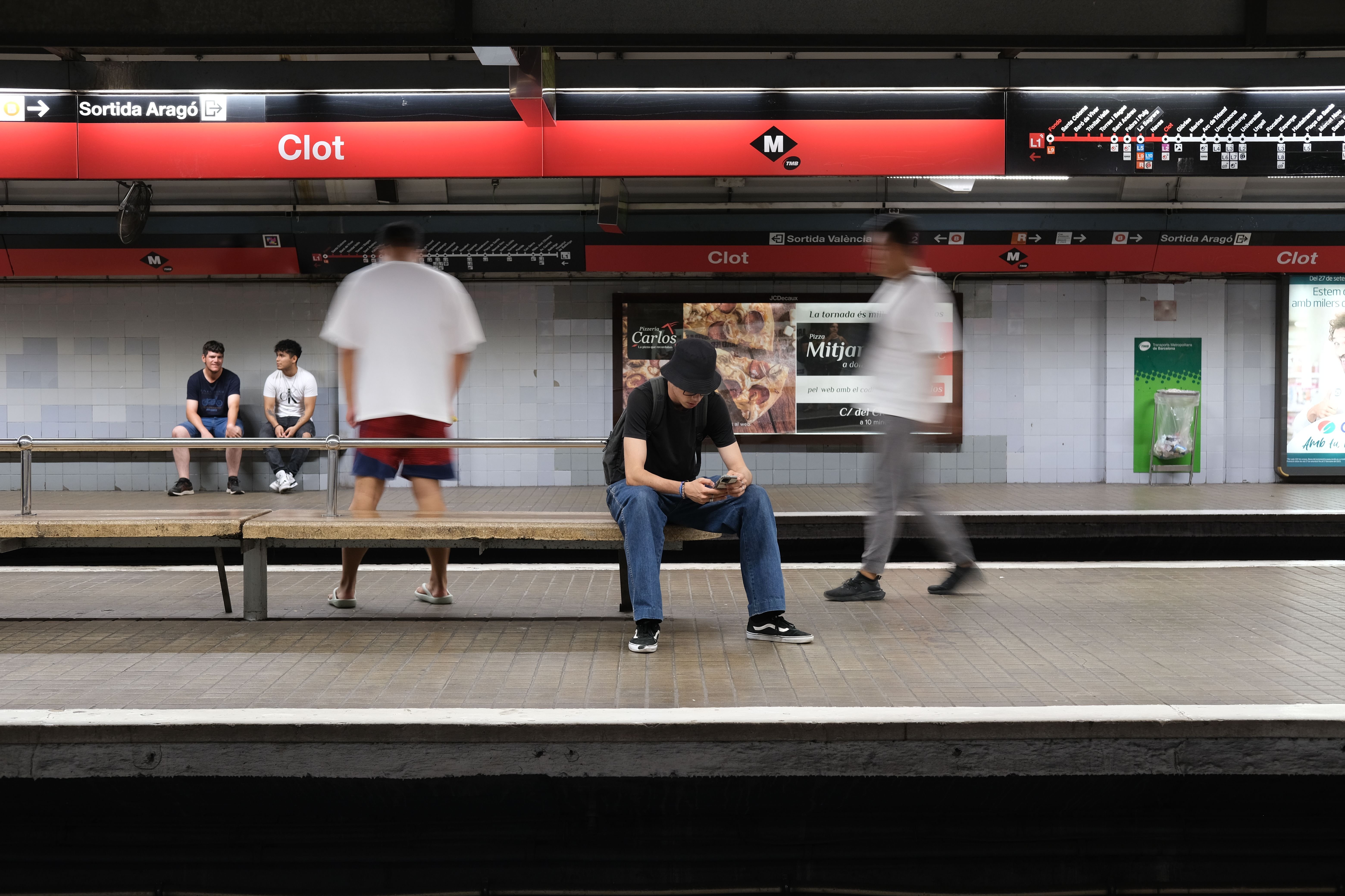 Barcelona metro entrance or platform with the red diamond M signage