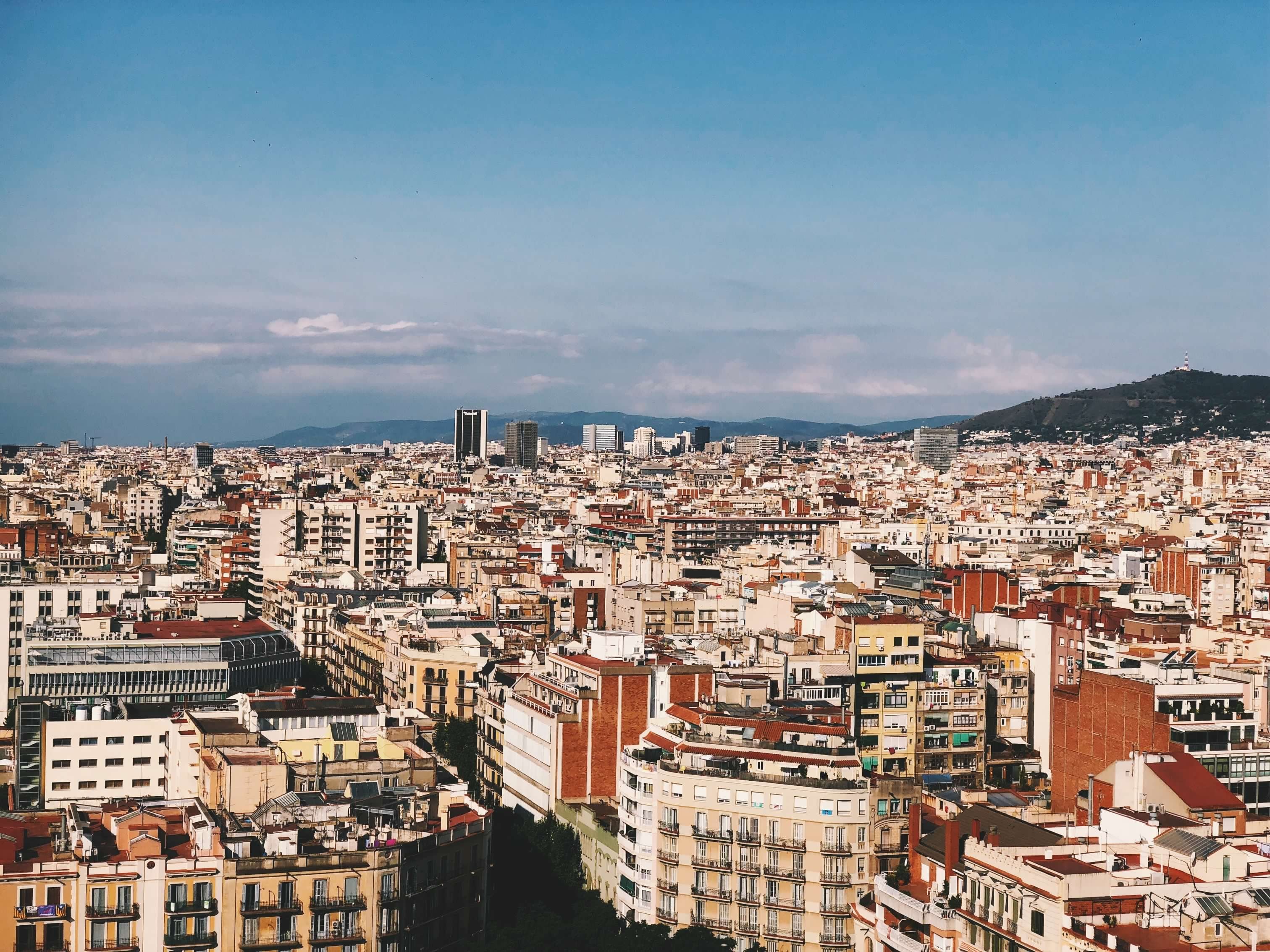 A Barcelona hotel reception / check-in desk, or a clean shot of the city skyline