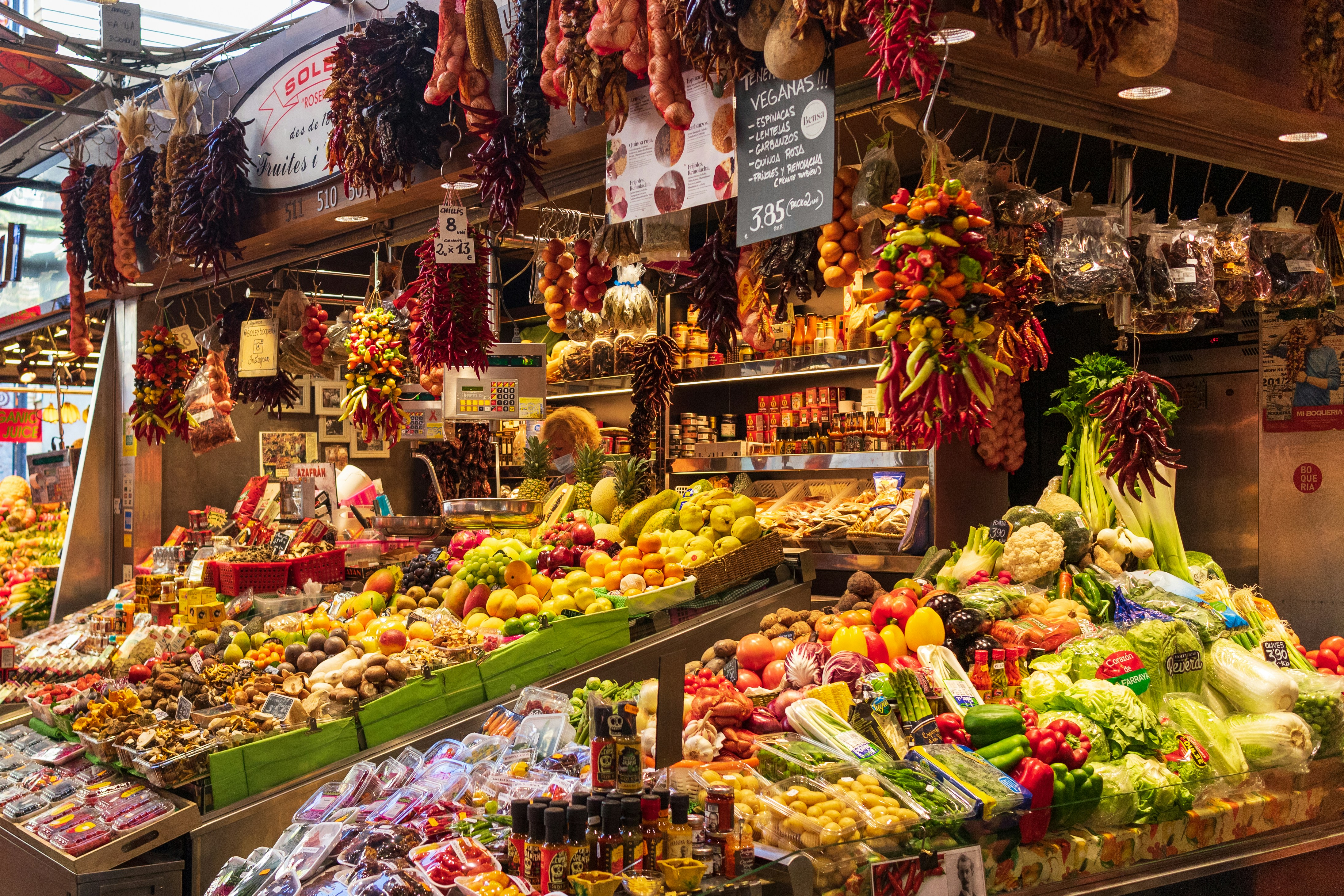 A Barcelona café meal or market scene suggesting everyday spending