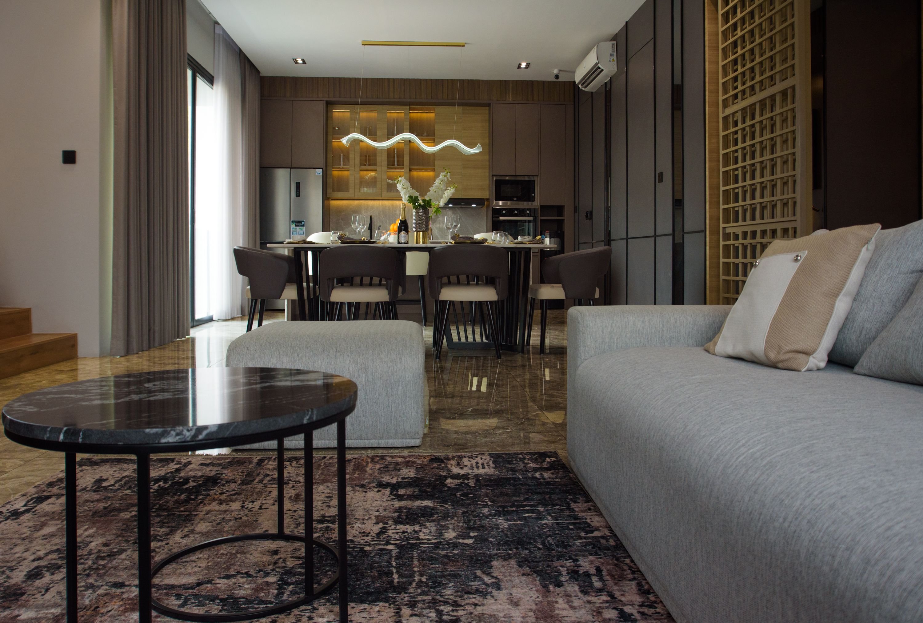A family-friendly Barcelona scene — kids at a beach or a spacious bright family hotel room/apartment