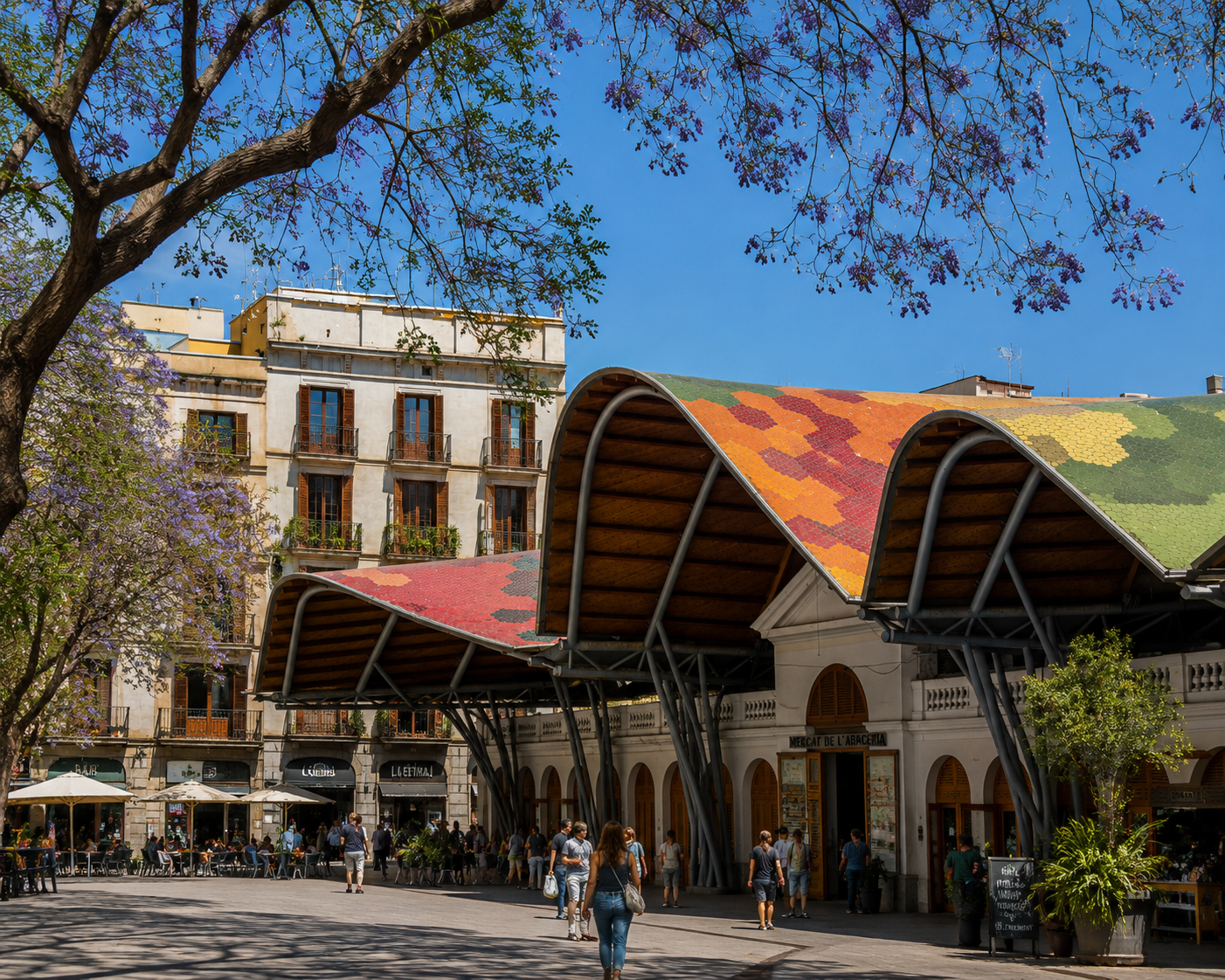 The colorful entrance or interior of La Boqueria, stalls piled with produce