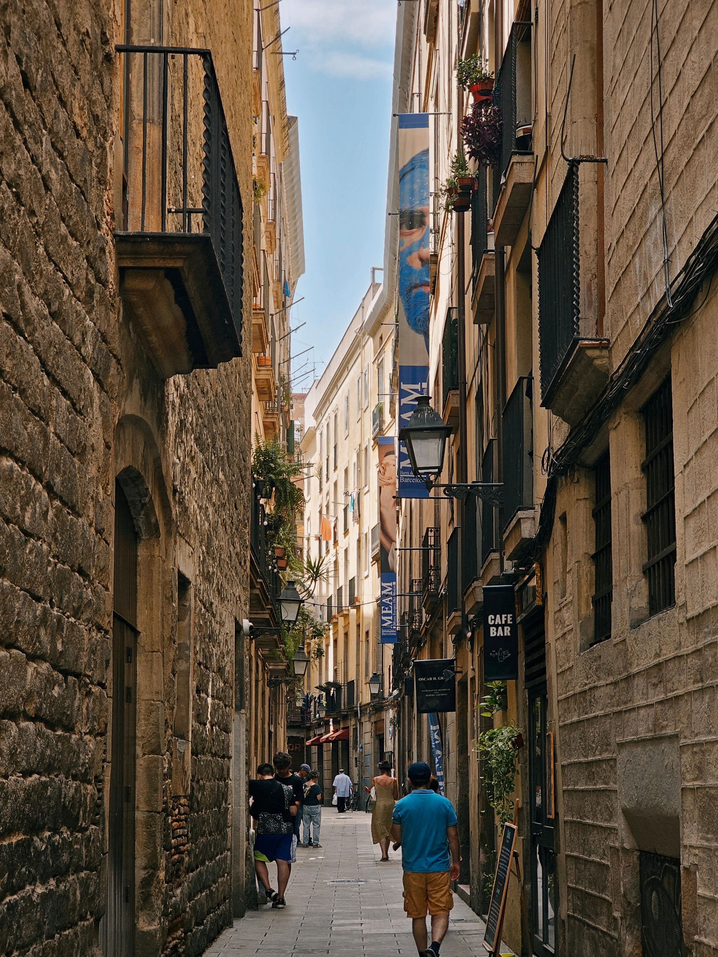 A value Barcelona neighborhood street (Poble-sec or Sant Antoni) with local cafes