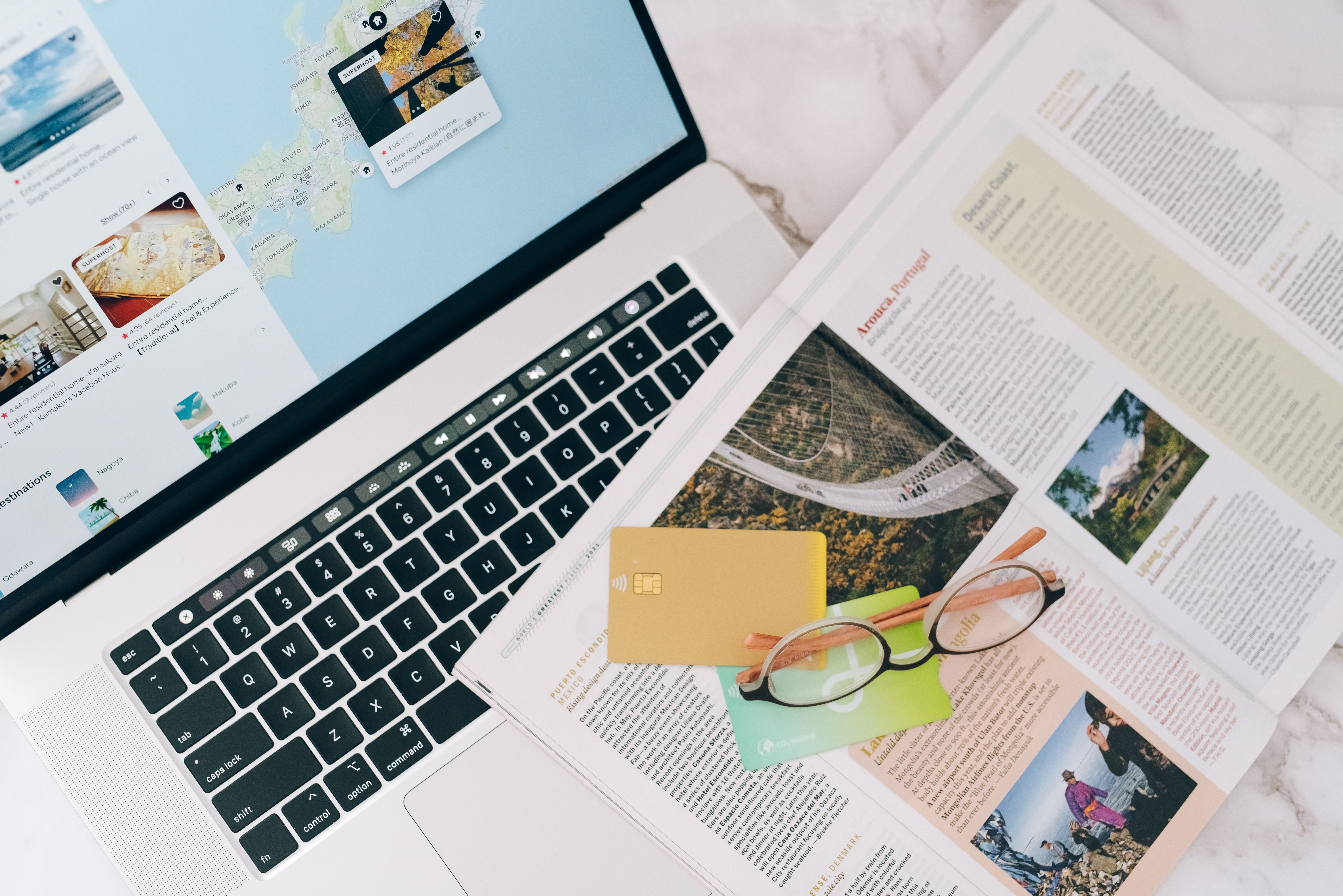 A traveler at a laptop / phone looking at official travel info, suggesting careful online prep