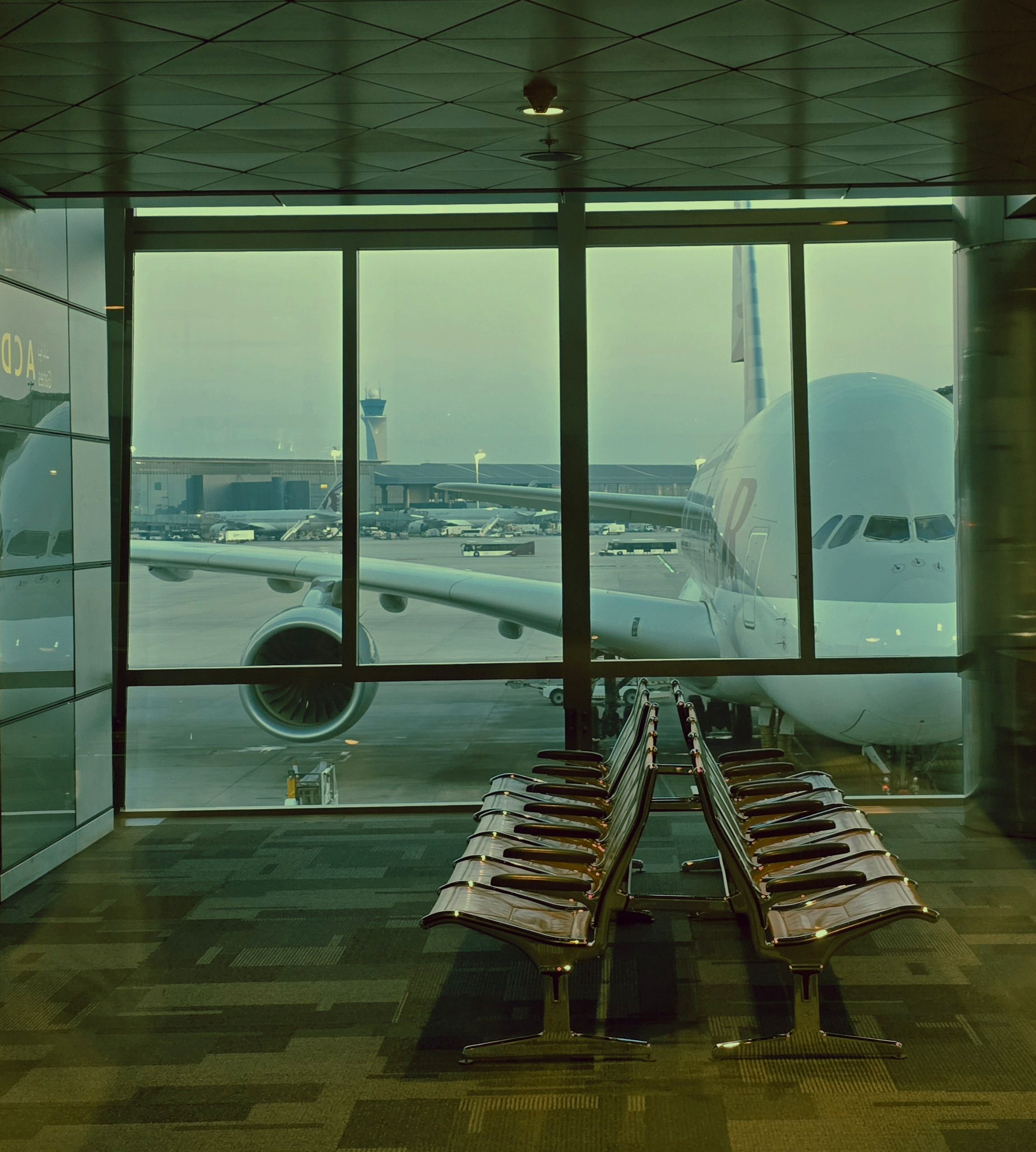 A widebody jet at a gate or Barcelona El Prat airport exterior