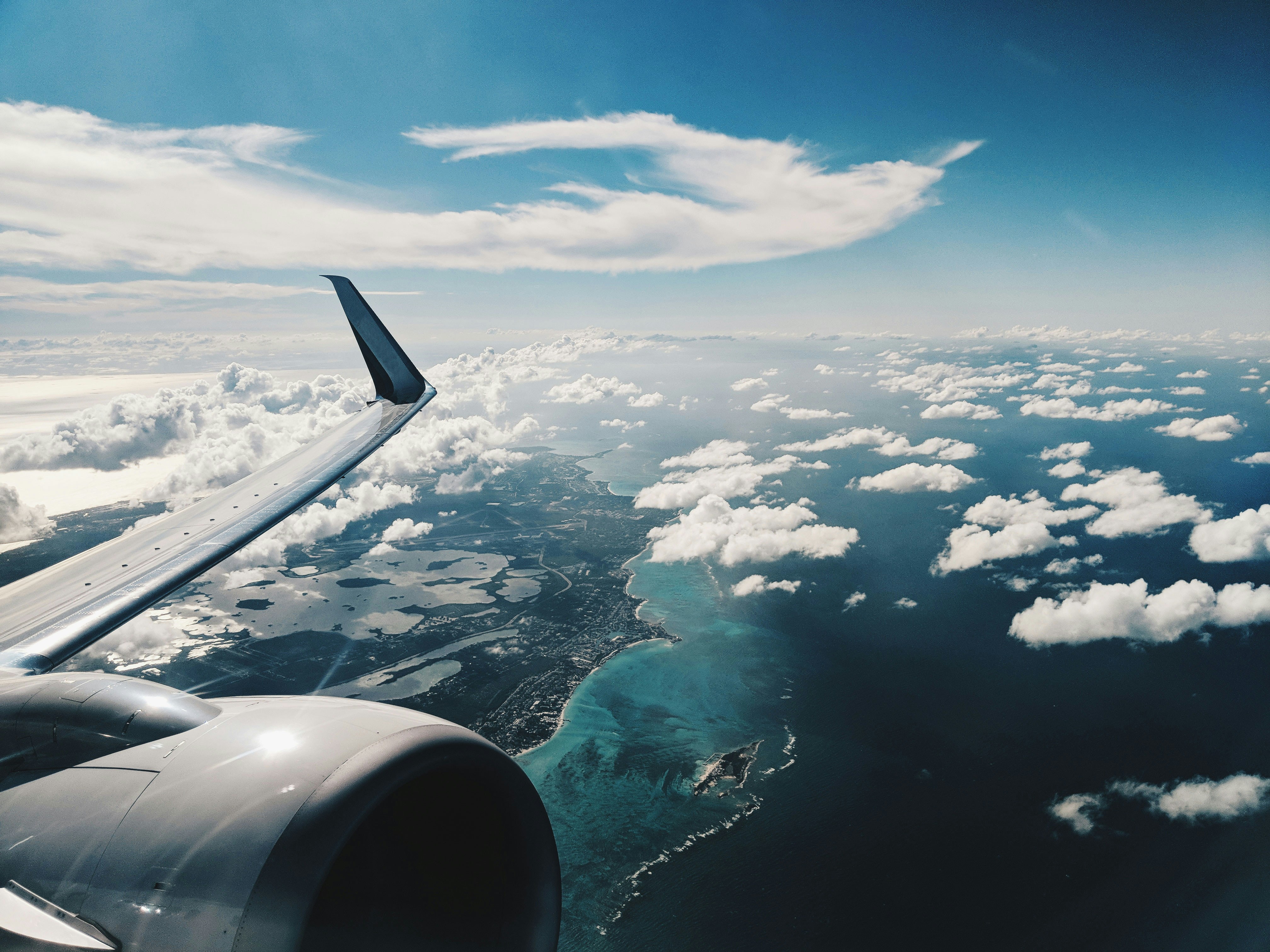 Airplane window view over the Mediterranean coast / Barcelona from above