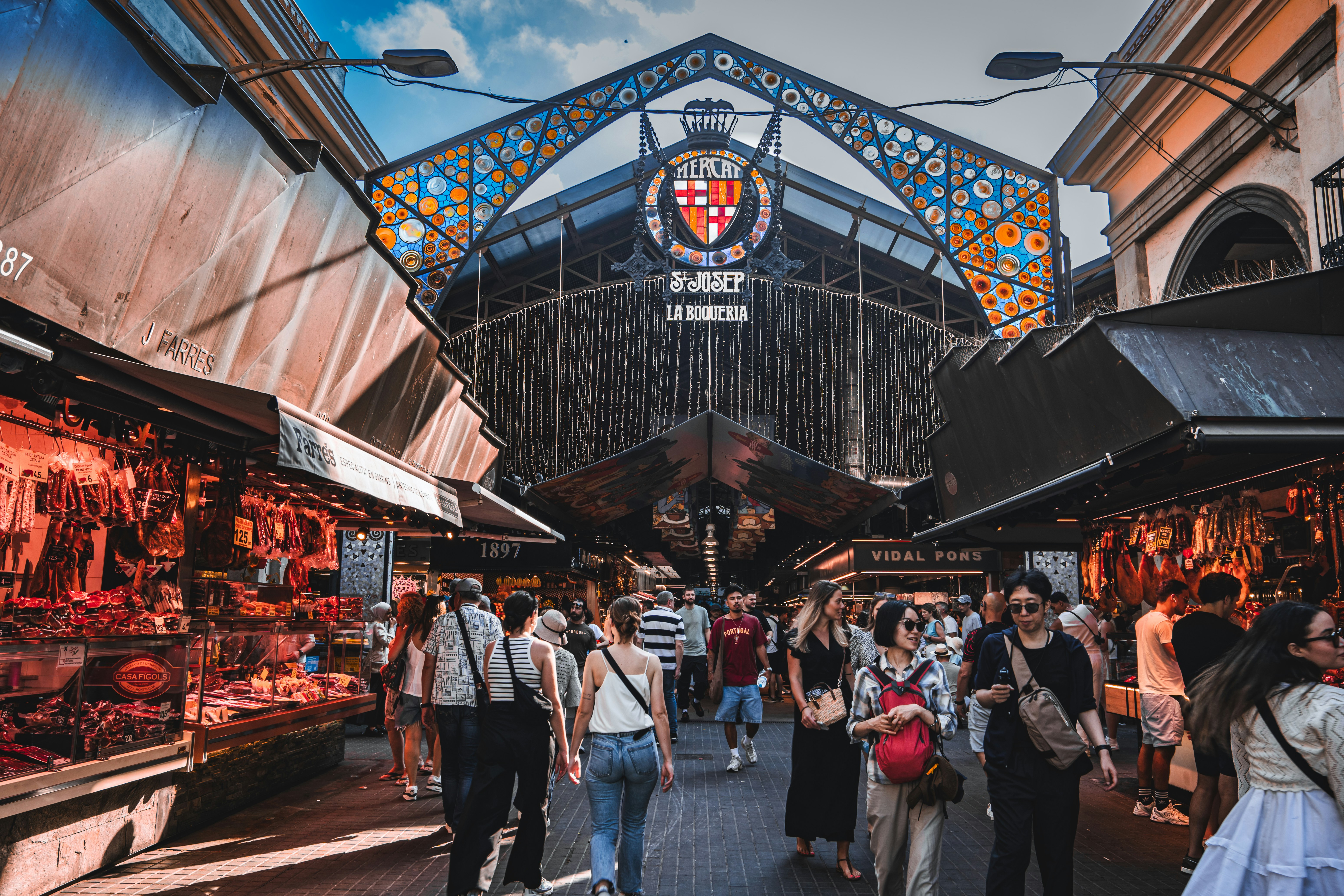 A vibrant tapas spread or a market food stall — colorful, appetizing, Barcelona-specific