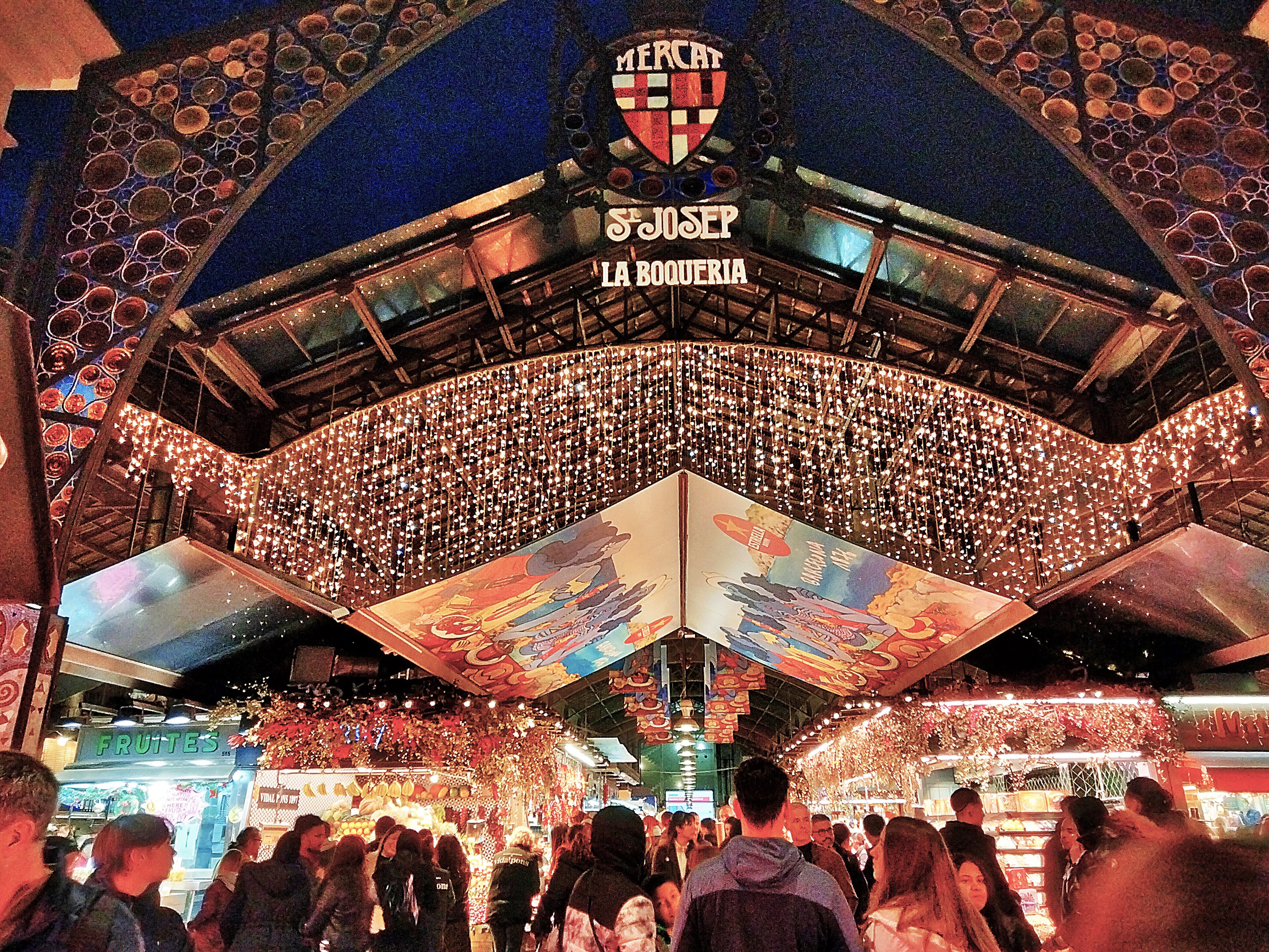 A free experience — a city beach, Ciutadella park greenery, or a market's colorful stalls