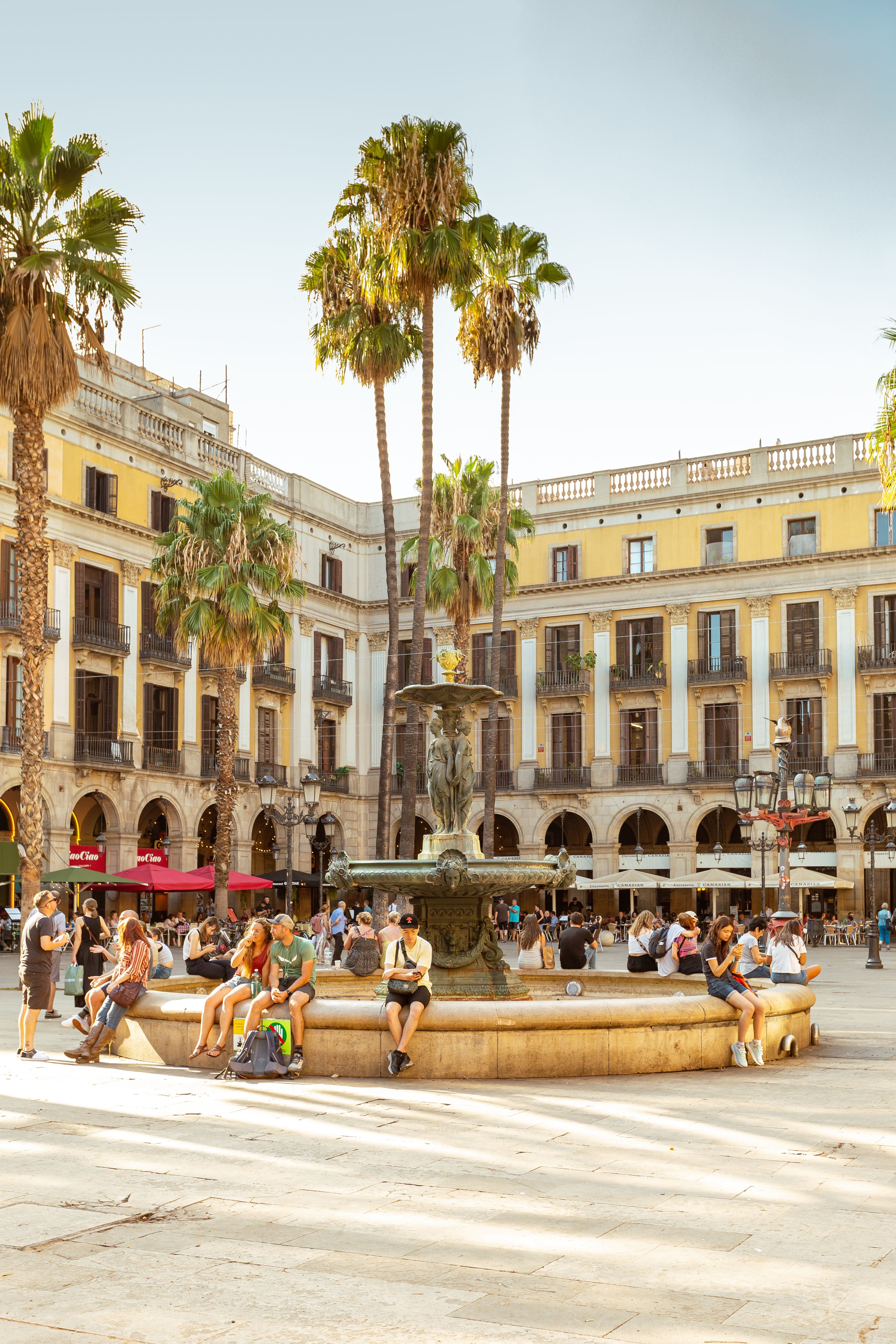 A Barcelona street scene with bilingual Catalan/Spanish signage, or locals chatting at a café