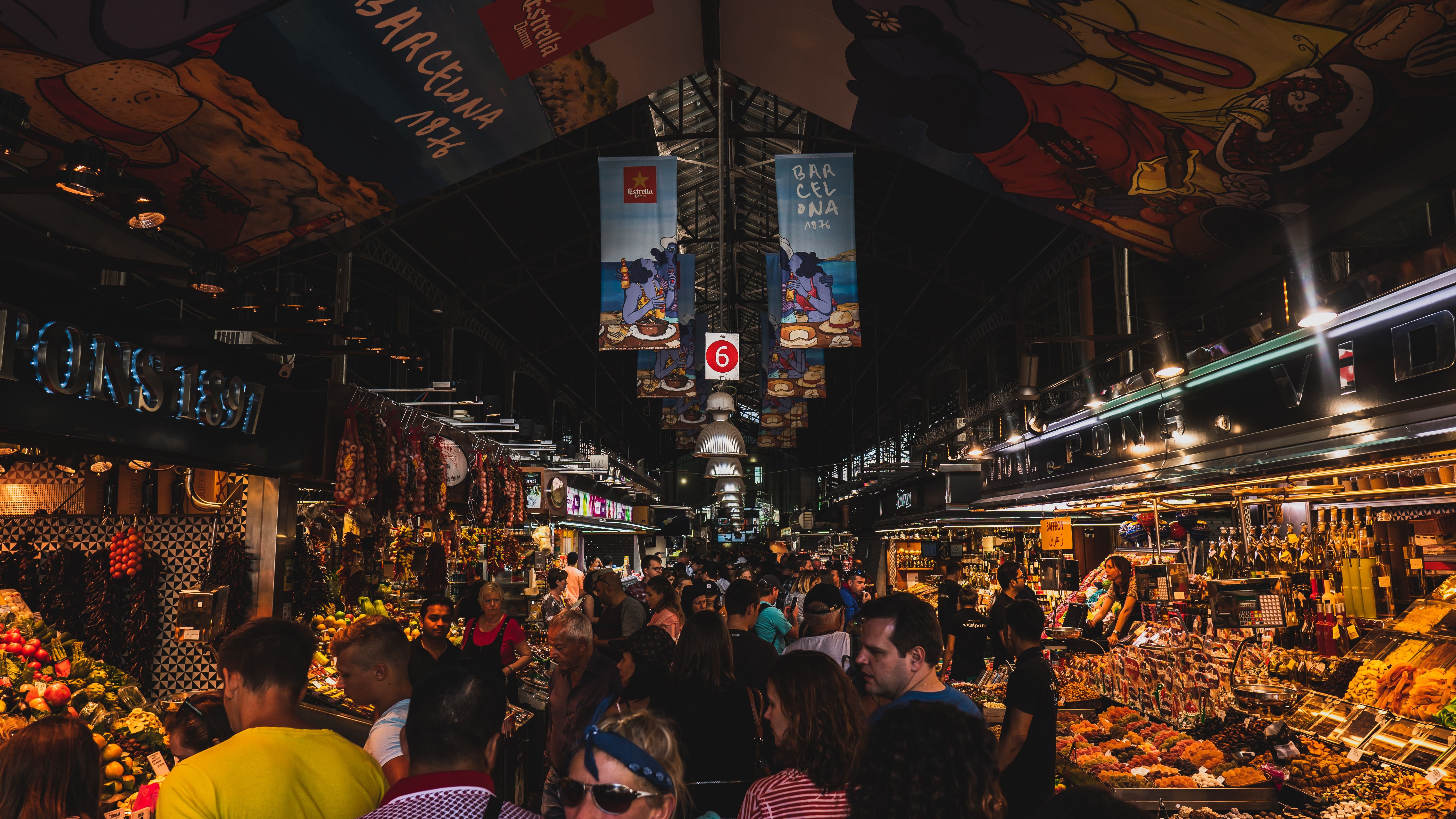 A lively pintxos bar on Carrer de Blai in Poble-sec, or the Sant Antoni market iron facade