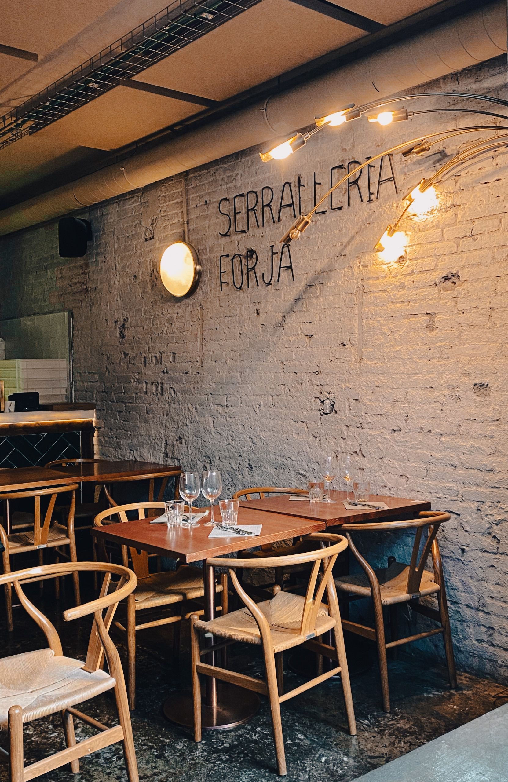 A Poblenou beach (Bogatell/Mar Bella), or a converted-factory creative space / café scene