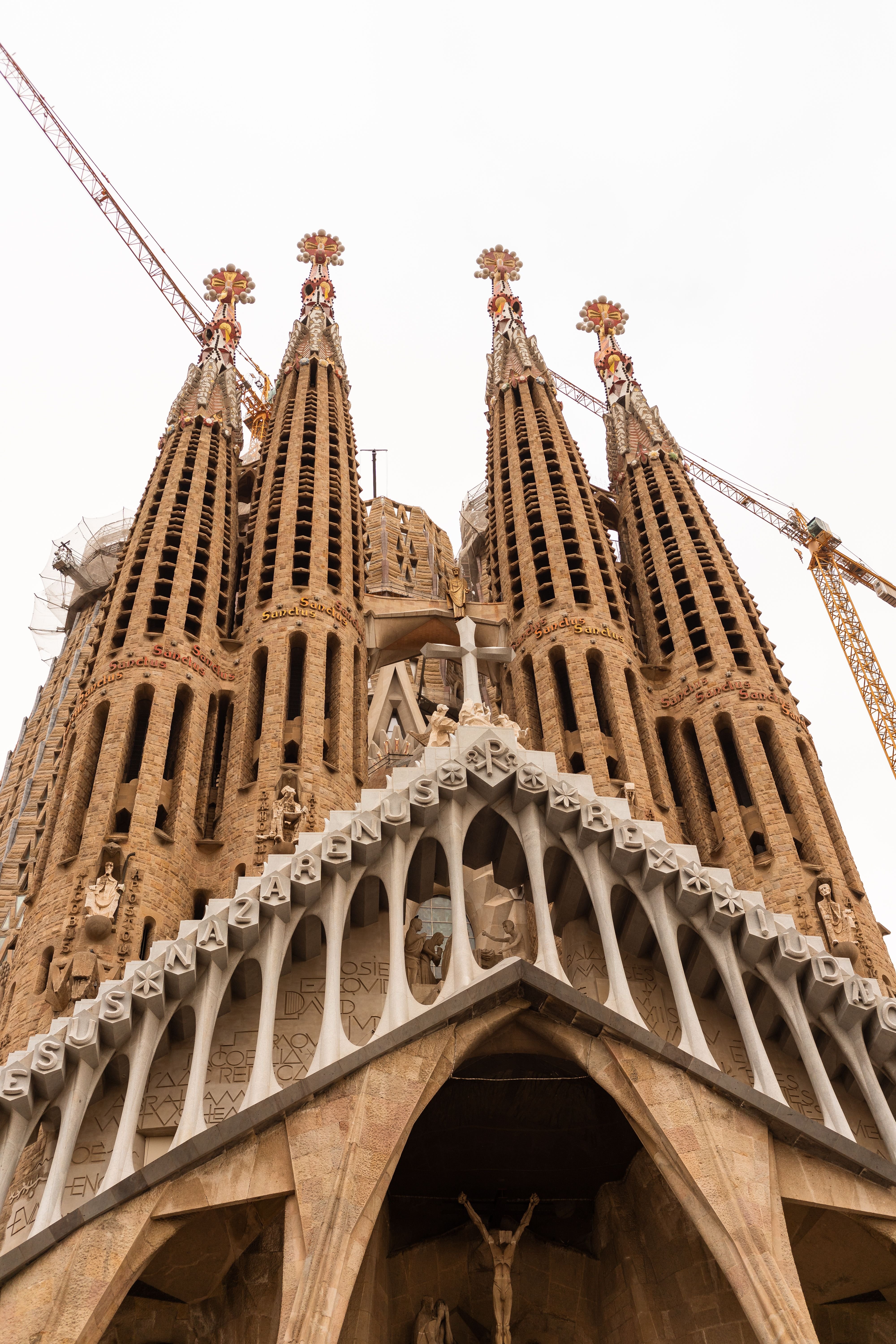 Sagrada Família exterior with the completed Tower of Jesus Christ, ideally with the new cross visible against 