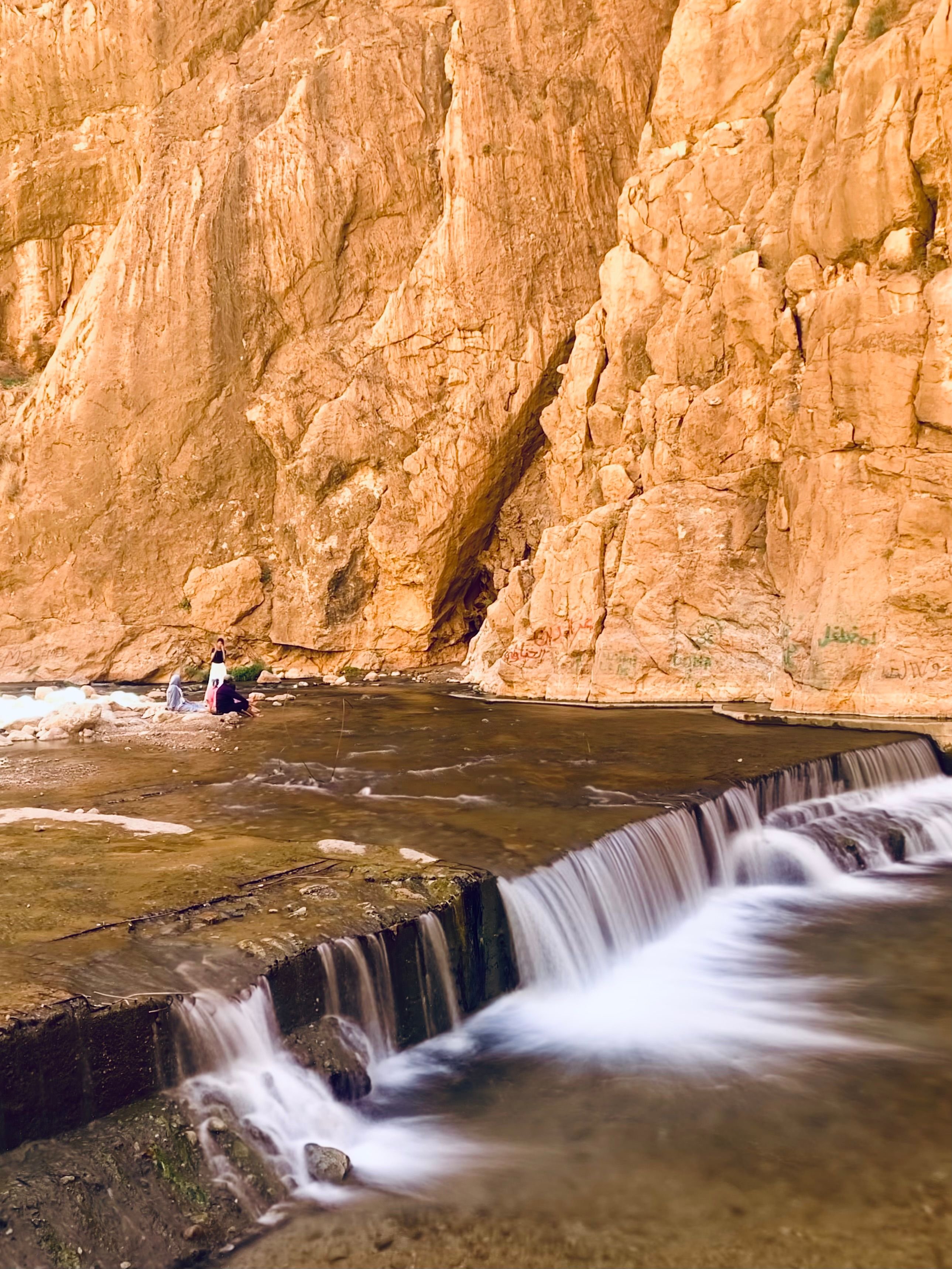 Traveler overlooking the Todra Gorge canyon walls in Morocco